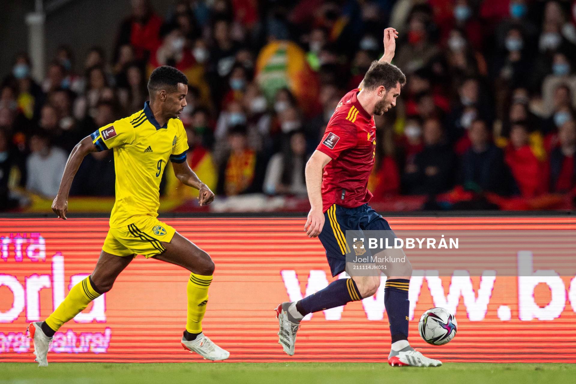 Alexander Isak of Sweden and Aymeric Laporte of Spain