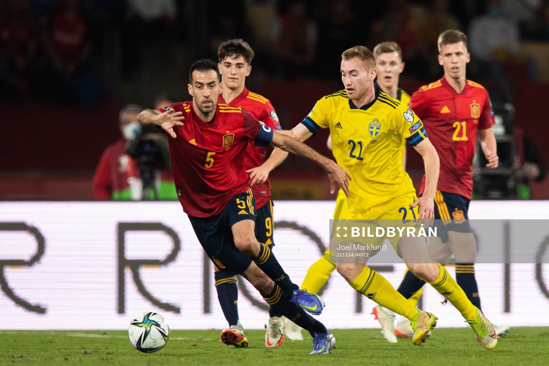 Sergio Busquets of Spain and Dejan Kulusevski of Sweden