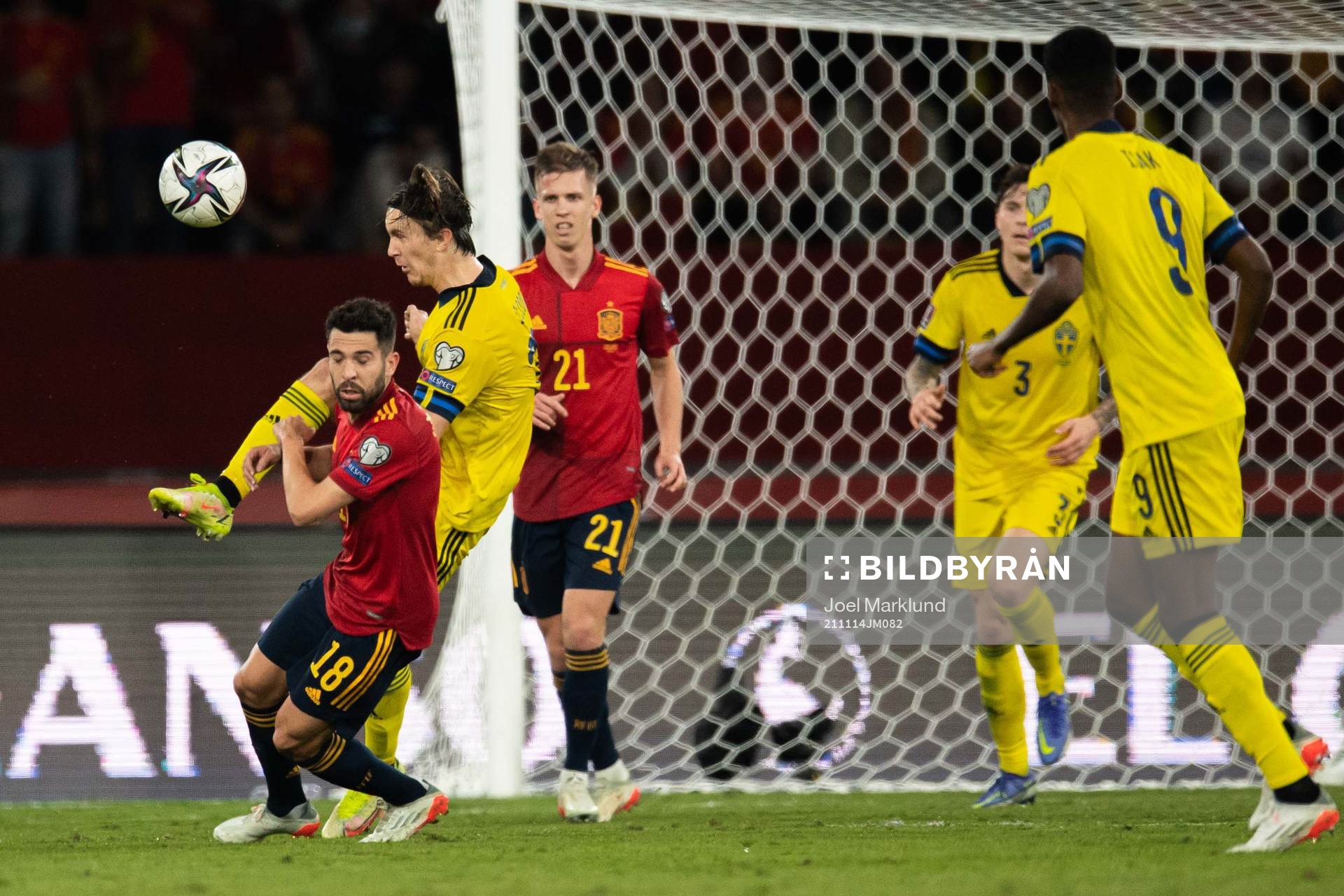 Jordi Alba of Spain and Kristoffer Olsson of Sweden