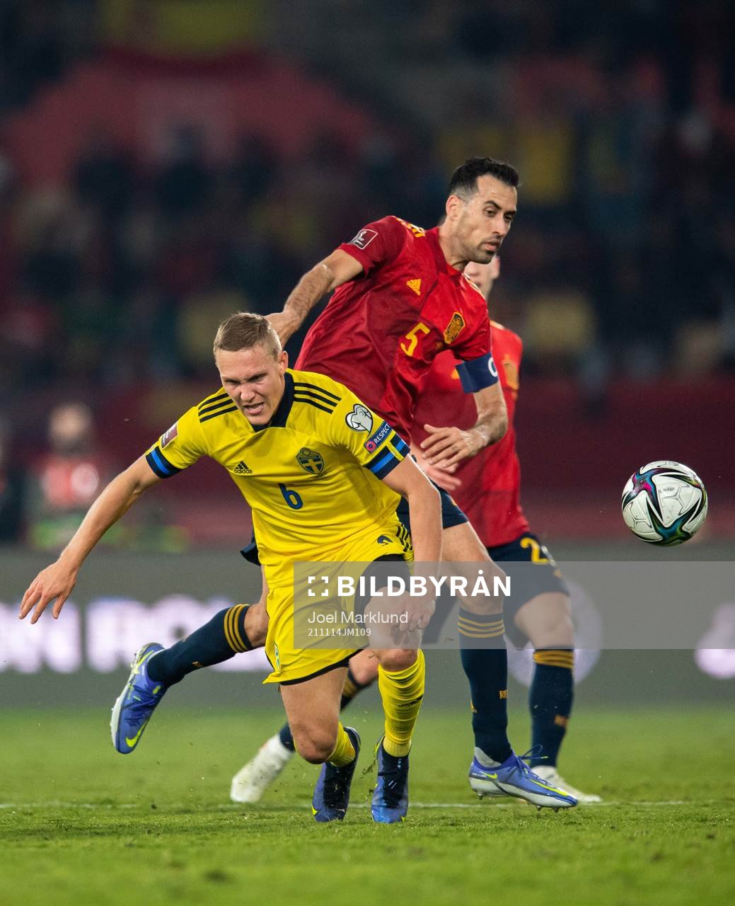 Ludwig Augustinsson of Sweden and Sergio Busquets of Spain
