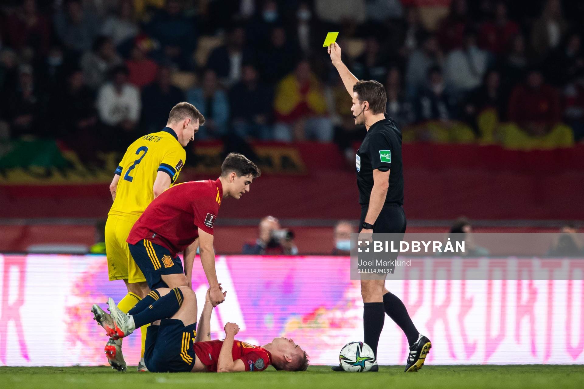 Emil Krafth of Sweden receives a warning from referee Felix