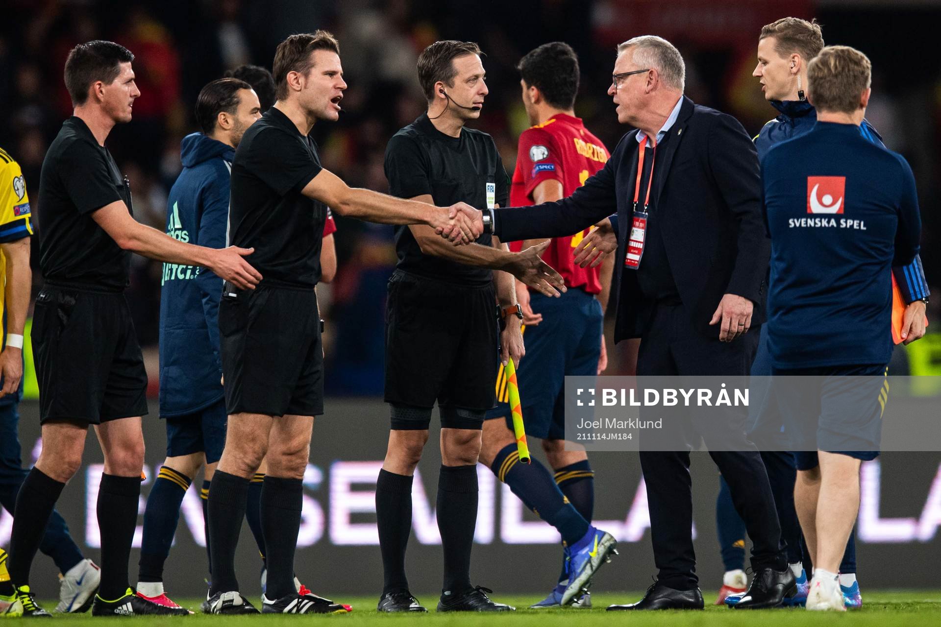 Referee Felix Brych and head coach Janne Andersson of Sweden
