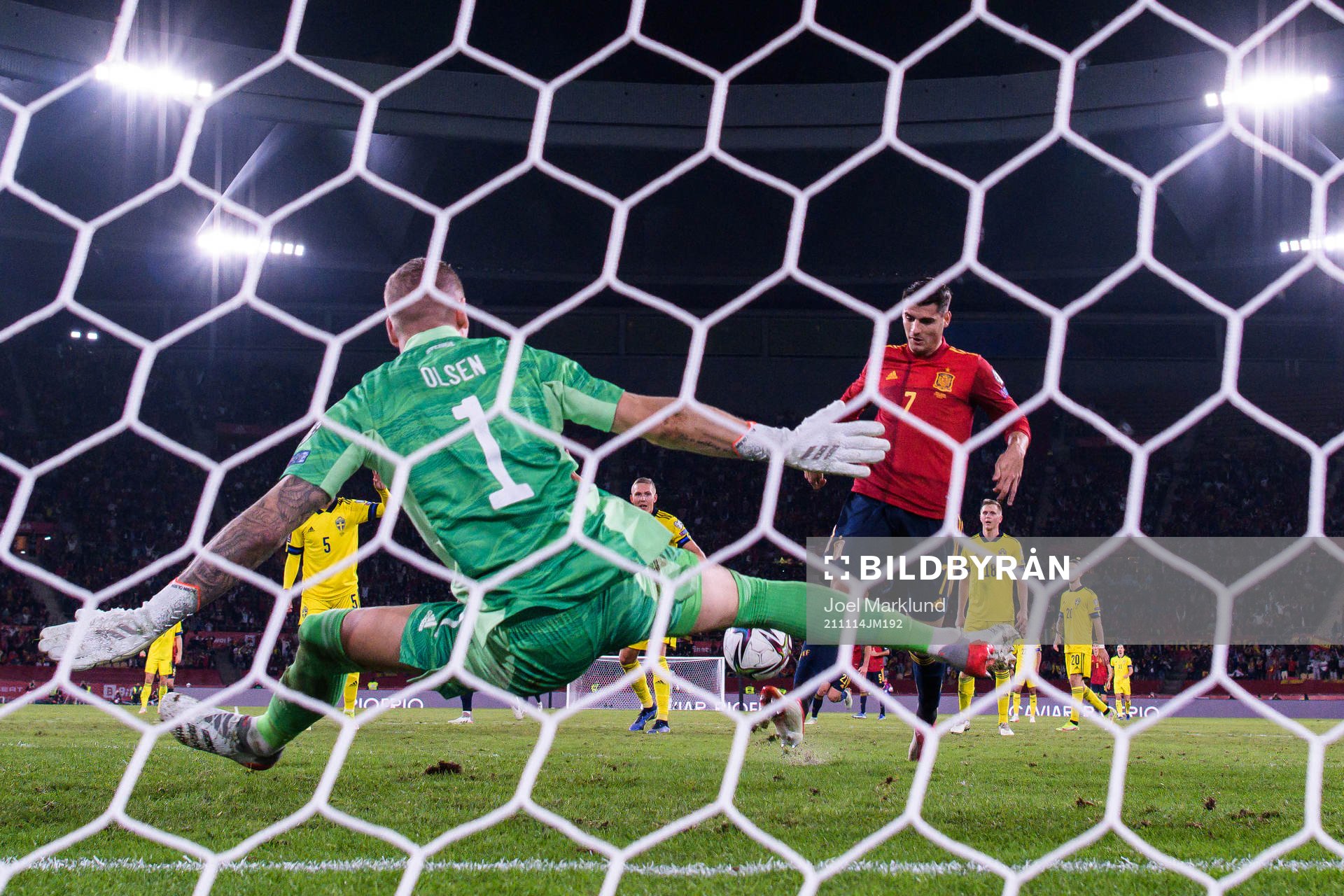 Alvaro Morata of Spain scores 1-0 behind goalkeeper Robin