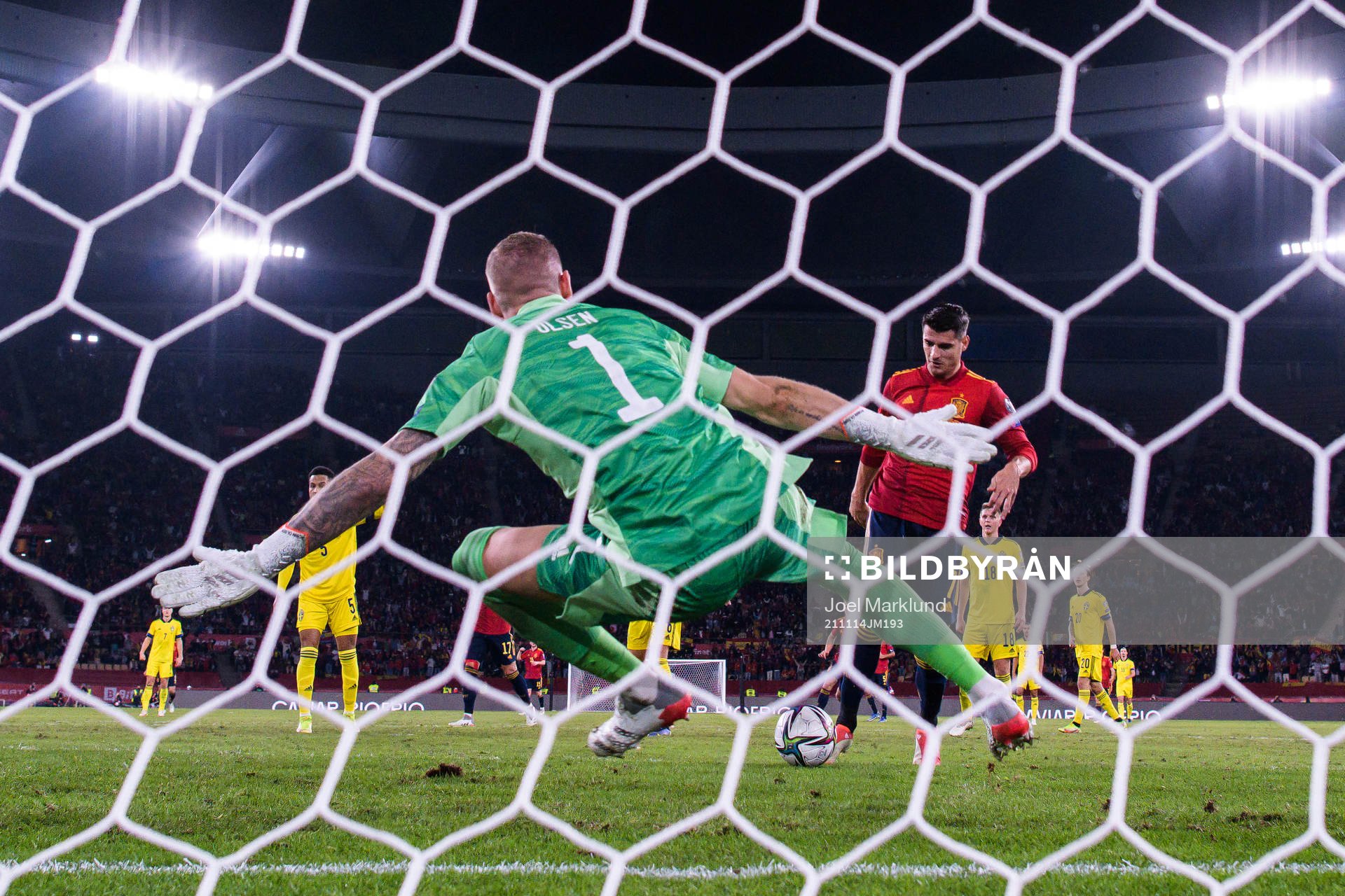 Alvaro Morata of Spain scores 1-0 behind goalkeeper Robin
