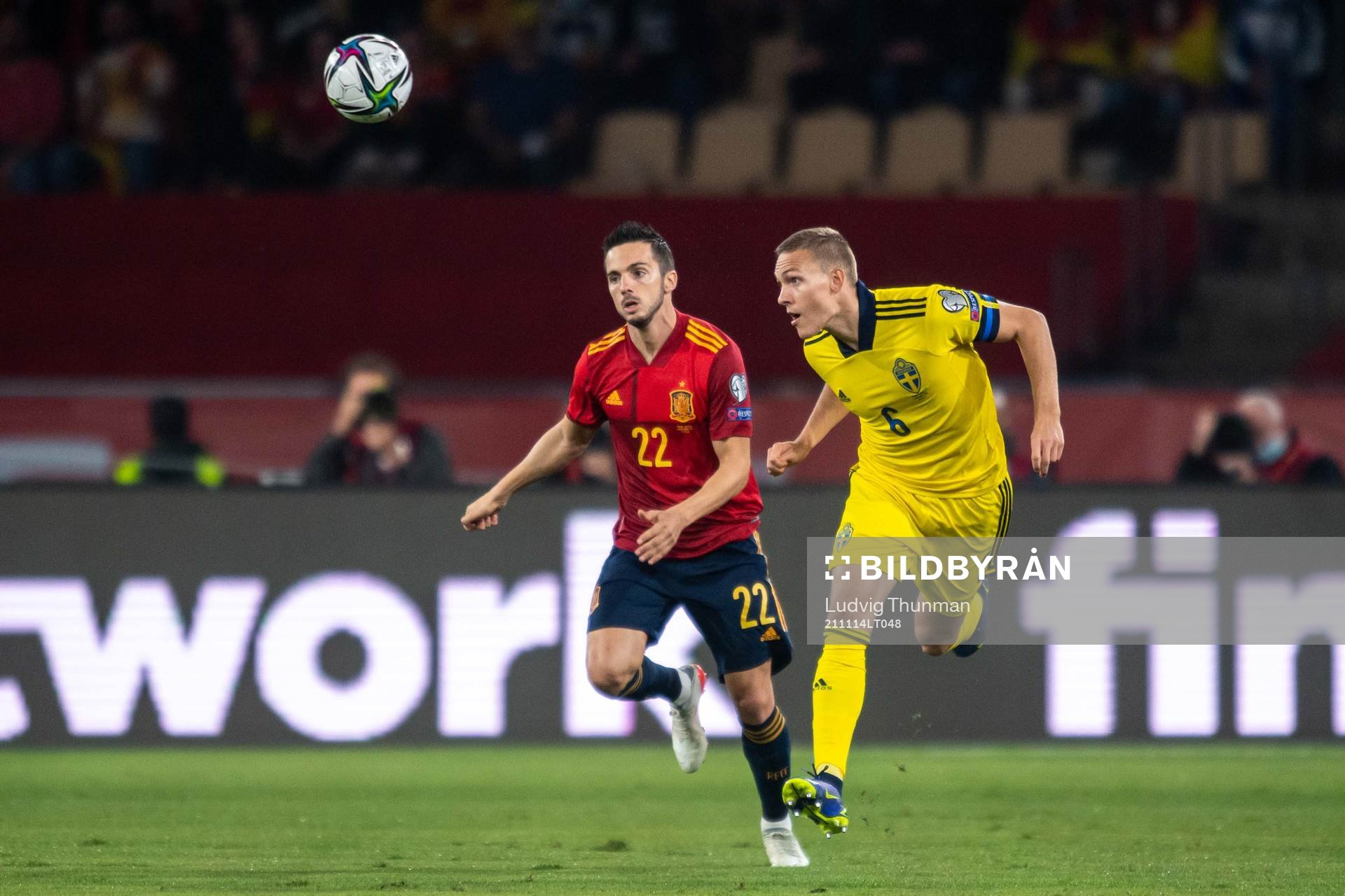 Pablo Sarabia of Spain and Ludwig Augustinsson of Sweden