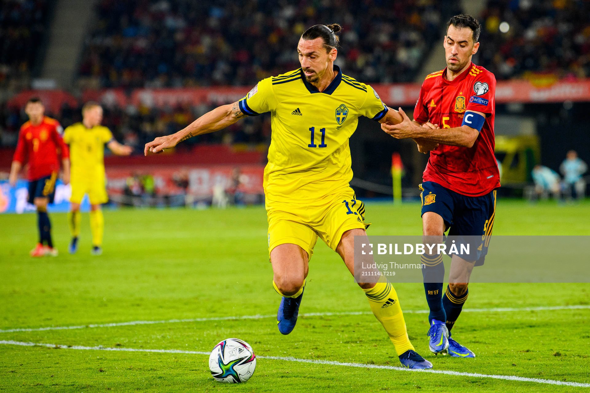 Zlatan Ibrahimovic of Sweden and Sergio Busquets of Spain