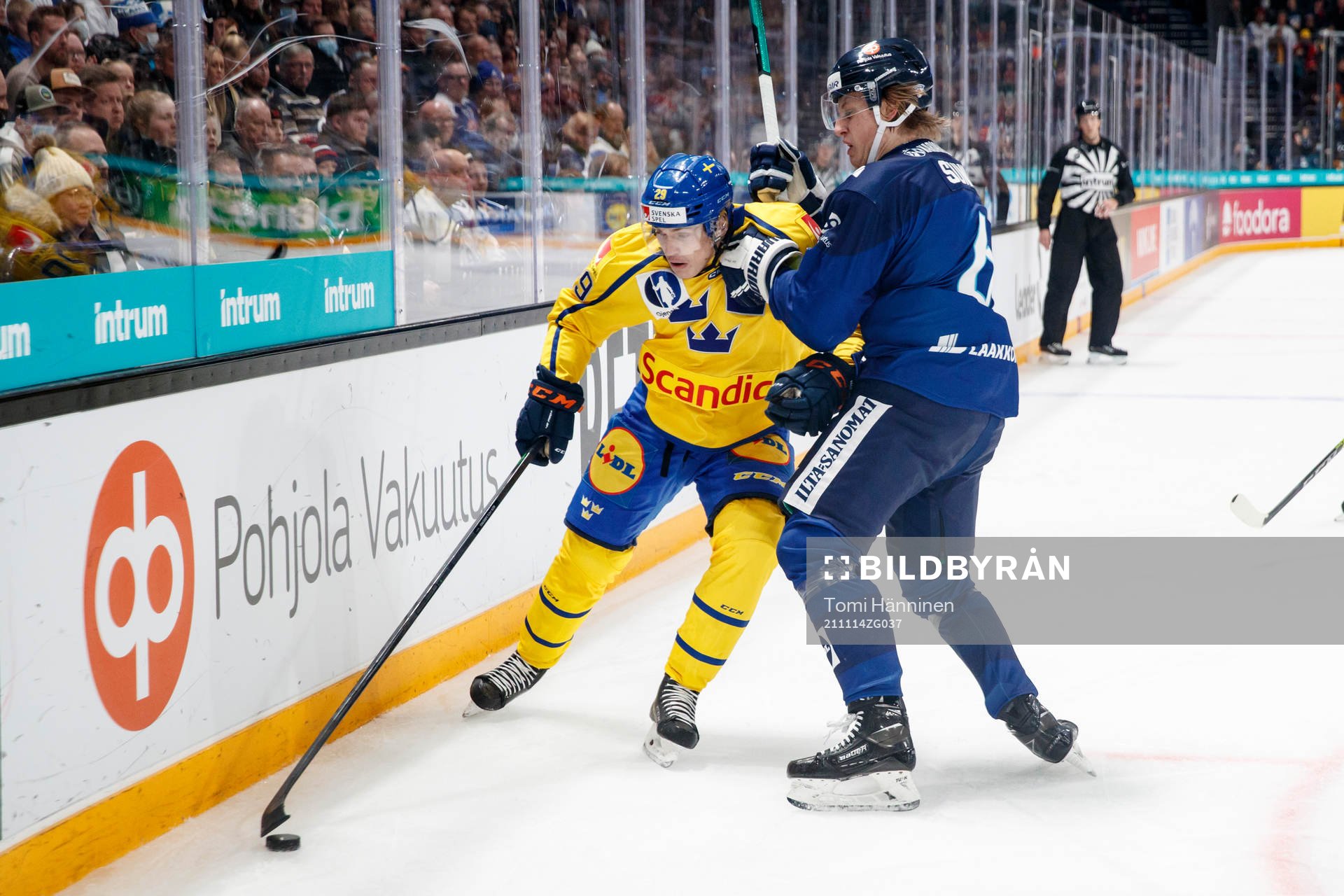 Pontus Holmberg of Sweden and Tony Sund #6 of Finland