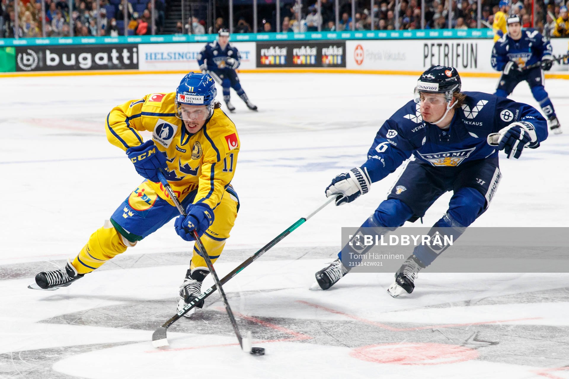 Joakim Nygård of Sweden and Tony Sund #6 of Finland