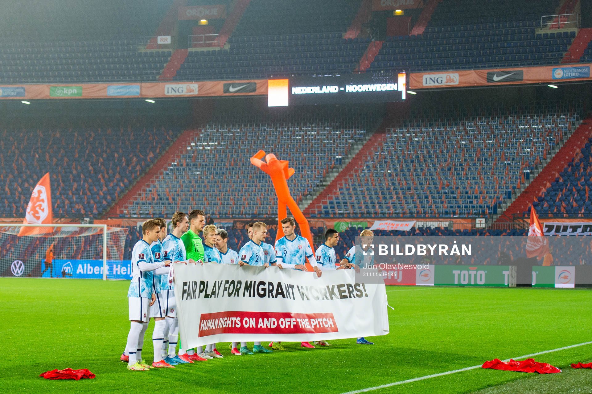 Players of Norway pose with a banner