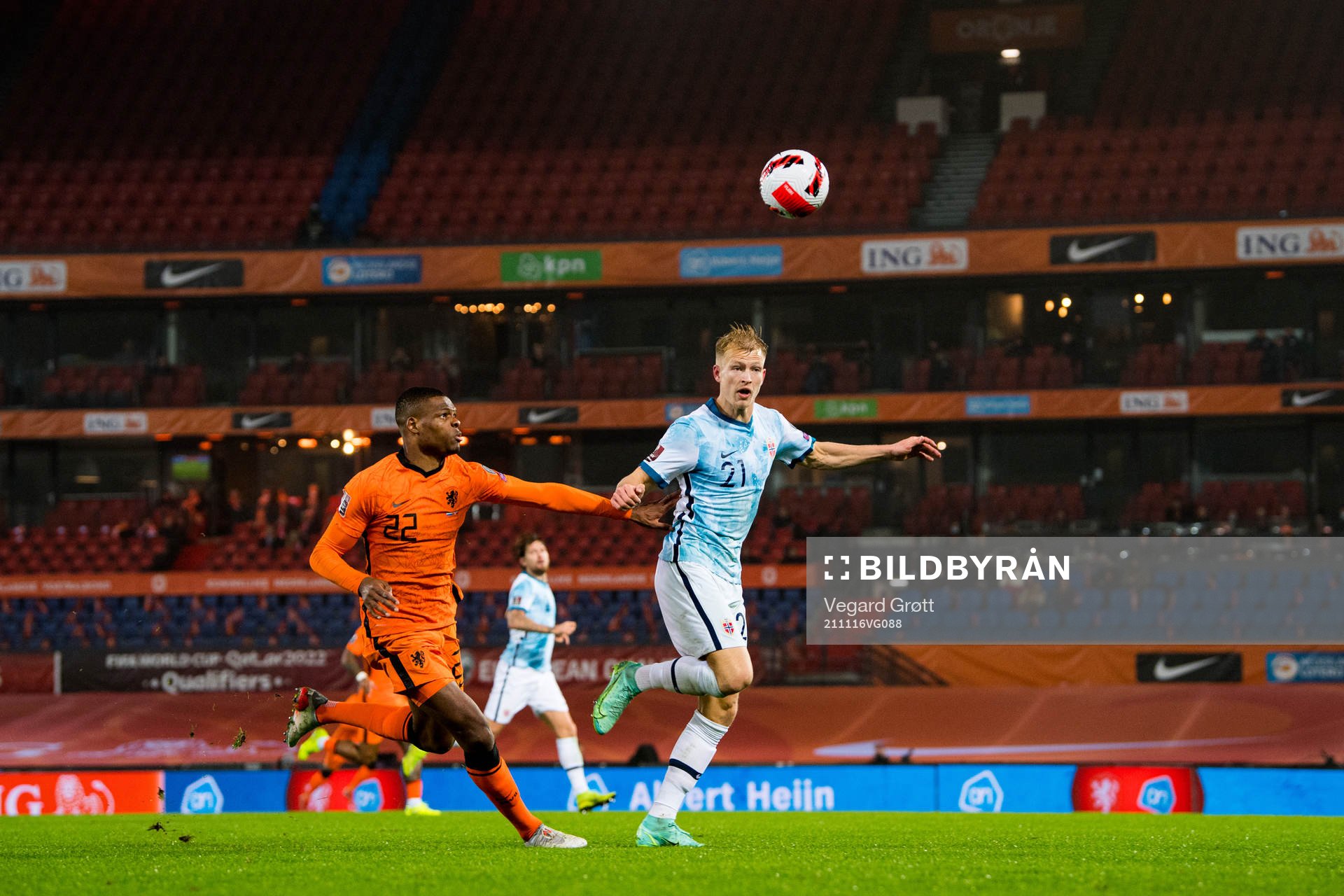 Denzel Dumfries of Netherlands and Andreas Hanche-Olsen of