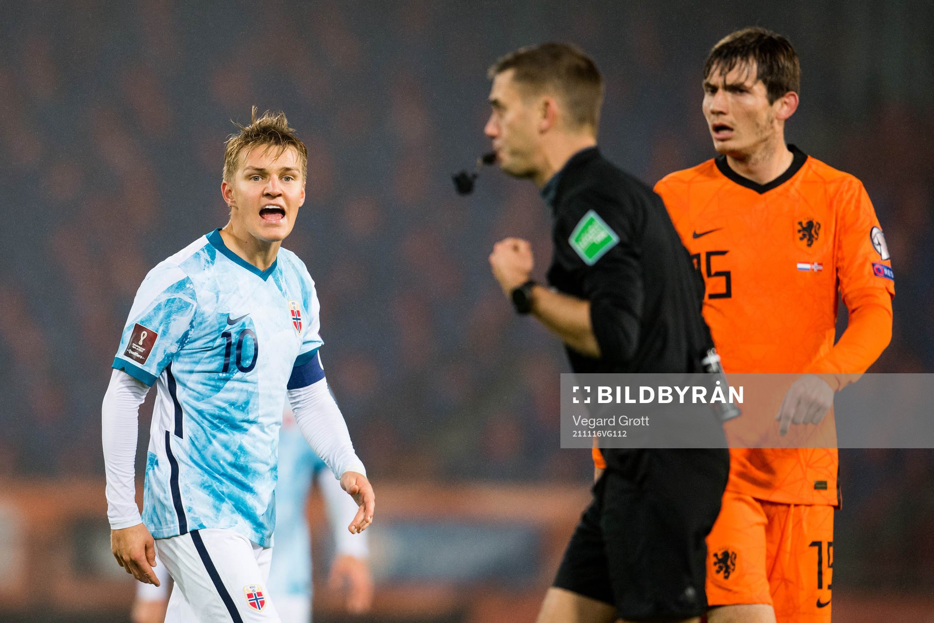 Martin Ødegaard of Norway reacts against Clément Turpin,