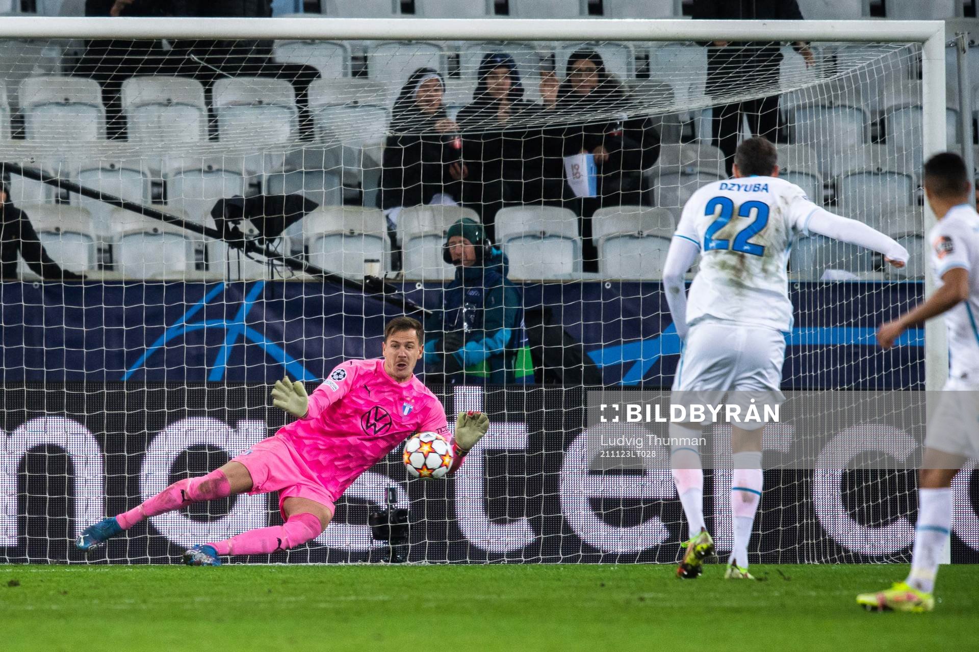 Goalkeeper Johan Dahlin of Malmö FF saves a penalty from Artem Dzyuba of Zenit during the UEFA Champions League football match between Malmö FF and Zenit St Petersburg on November 23, 2021 in Malmö. 