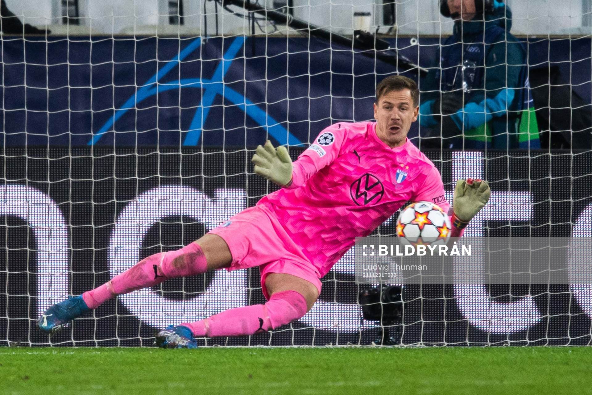 Goalkeeper Johan Dahlin of Malmö FF saves a penalty from