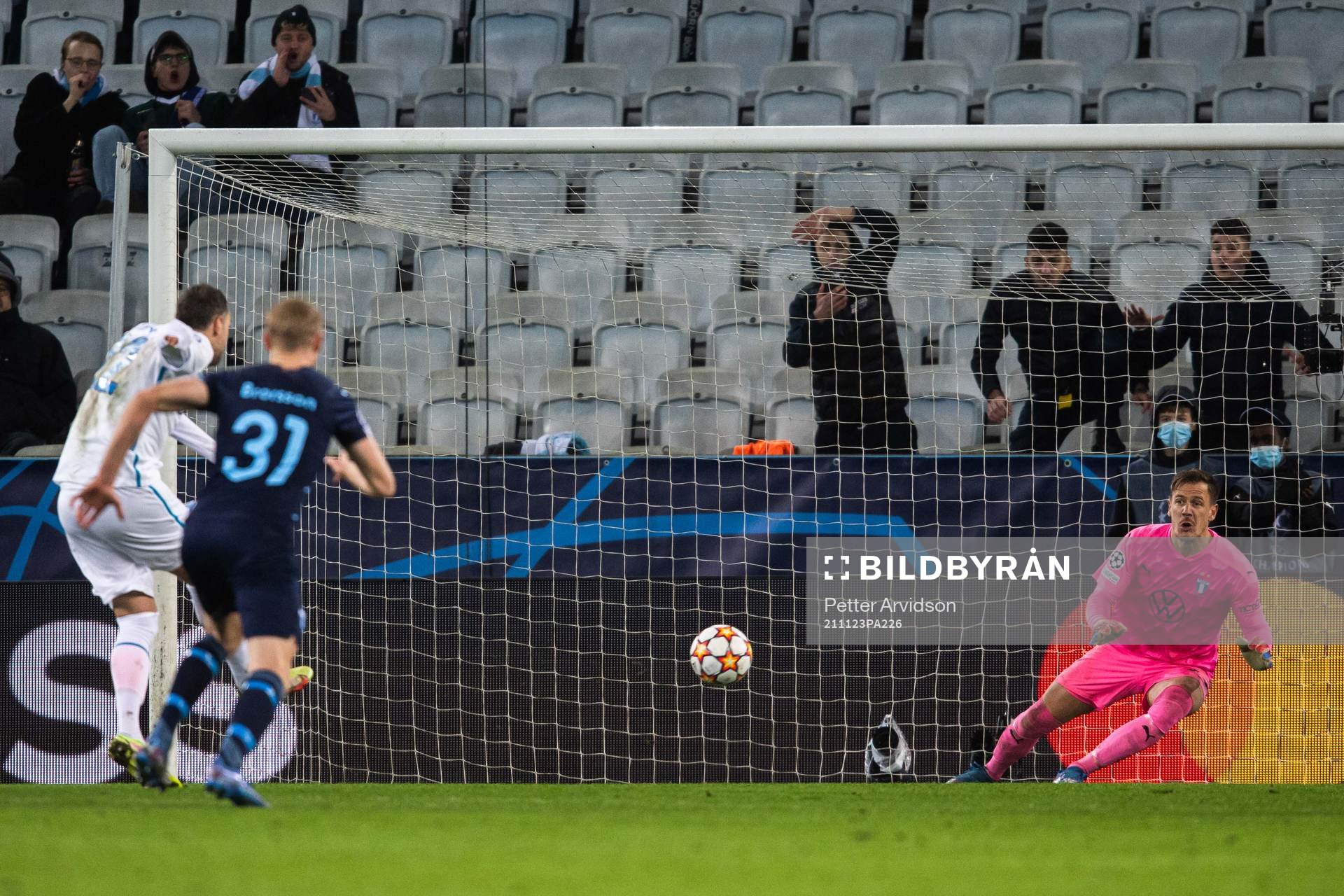 Goalkeeper Johan Dahlin of Malmö FF saves a penalty from