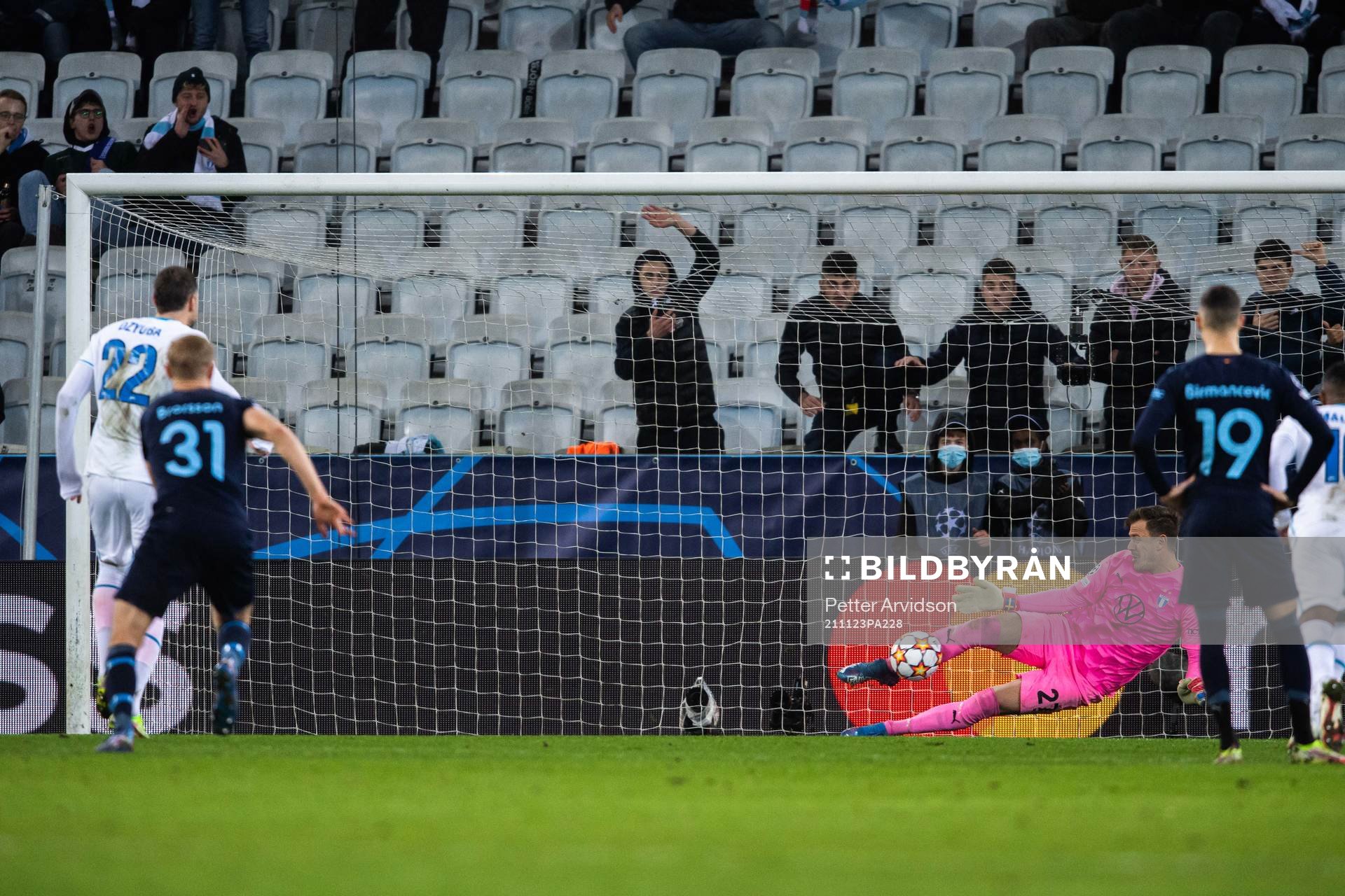 Goalkeeper Johan Dahlin of Malmö FF saves a penalty from