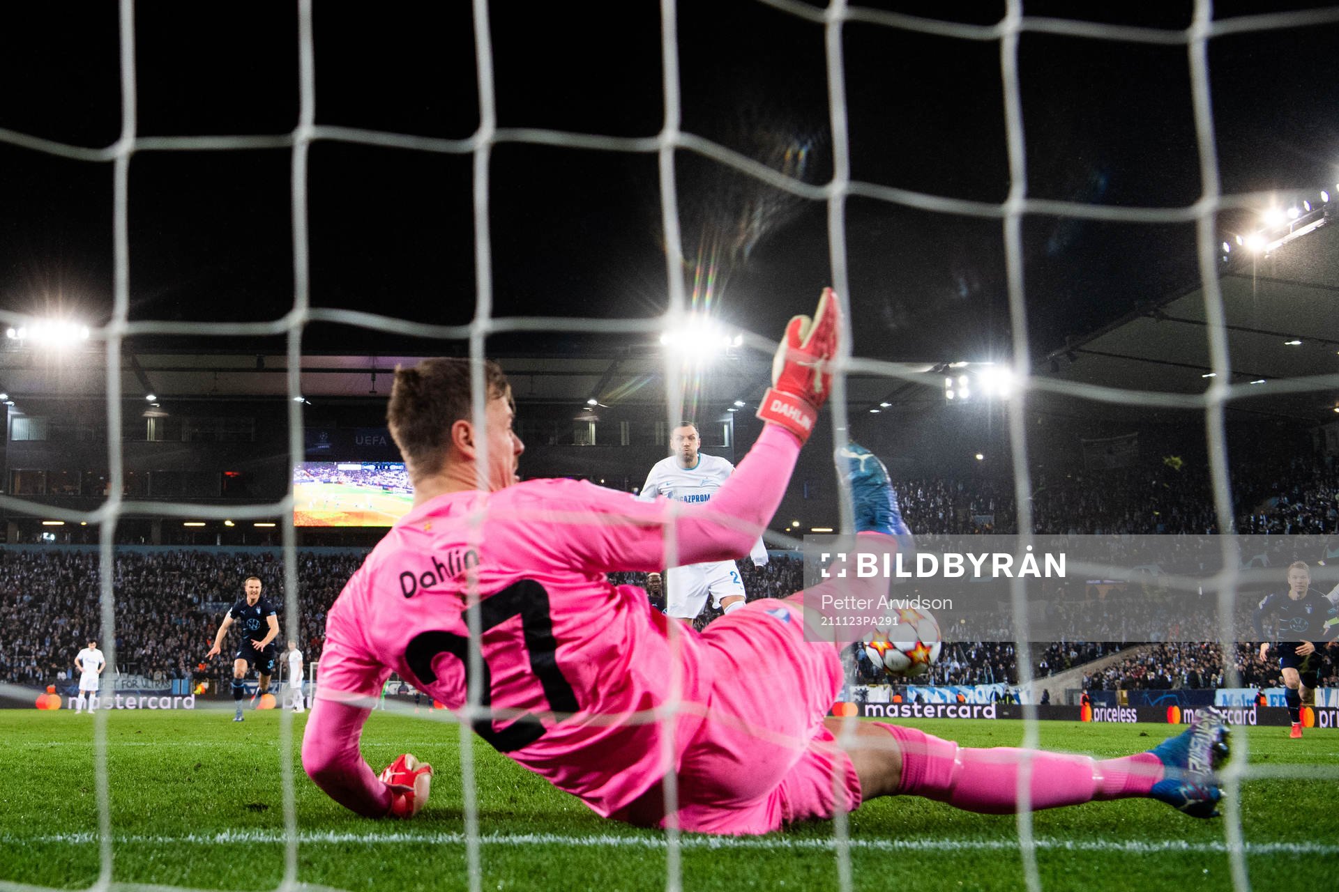 Goalkeeper Johan Dahlin of Malmö FF saves a penalty from