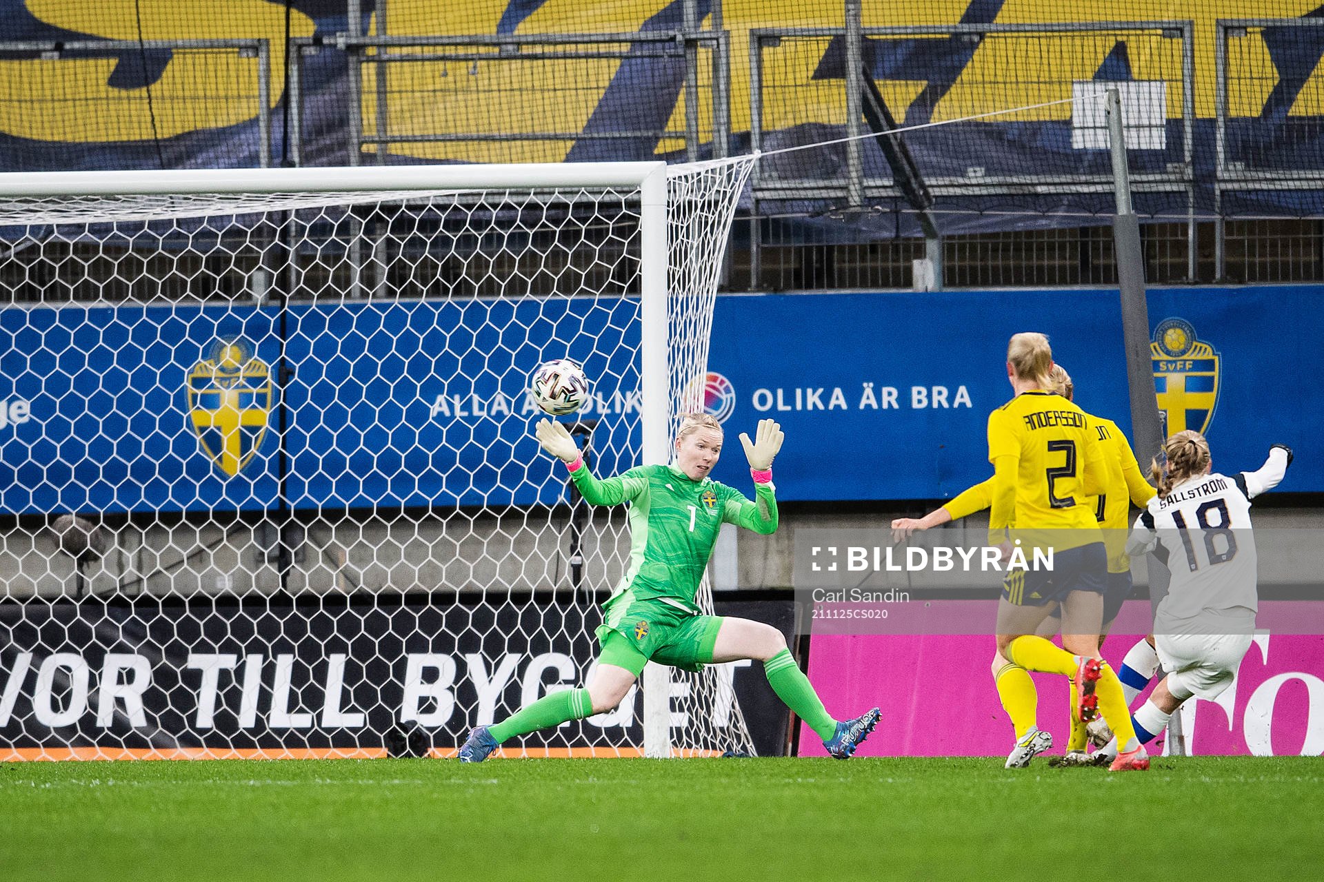 Linda Sällström of Finland scores 1-1 behind goalkeeper