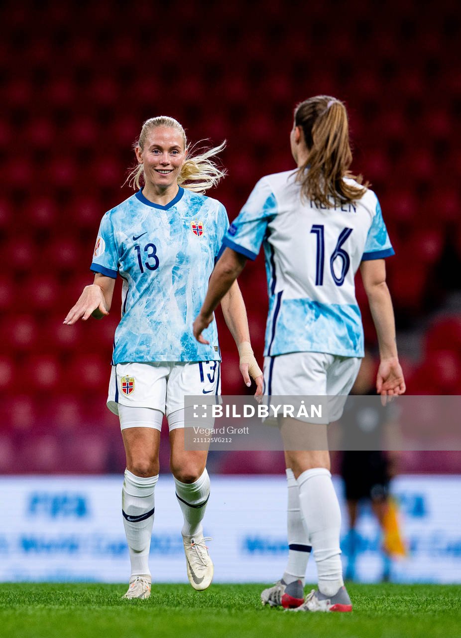 Guro Reiten of Norway celebrates with teammate Guro