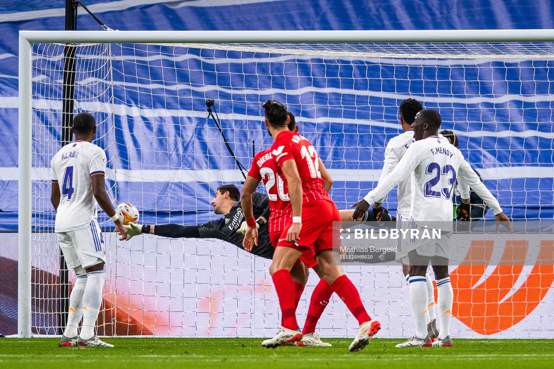 Rafa Mir of Sevilla scores 0-1 behind goalkeeper Thibaut