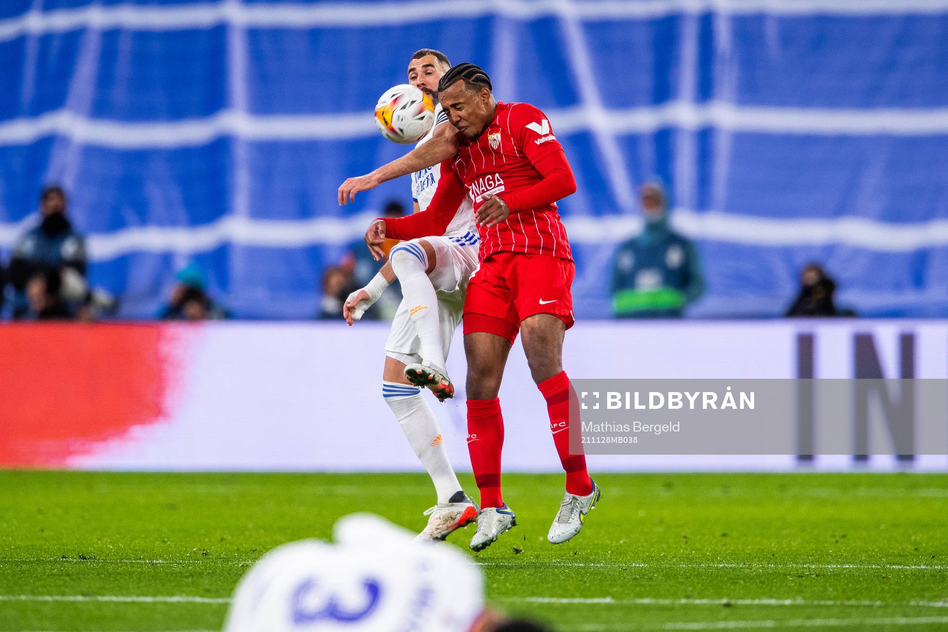 Karim Benzema of Real Madrid and Jules Kounde of Sevilla