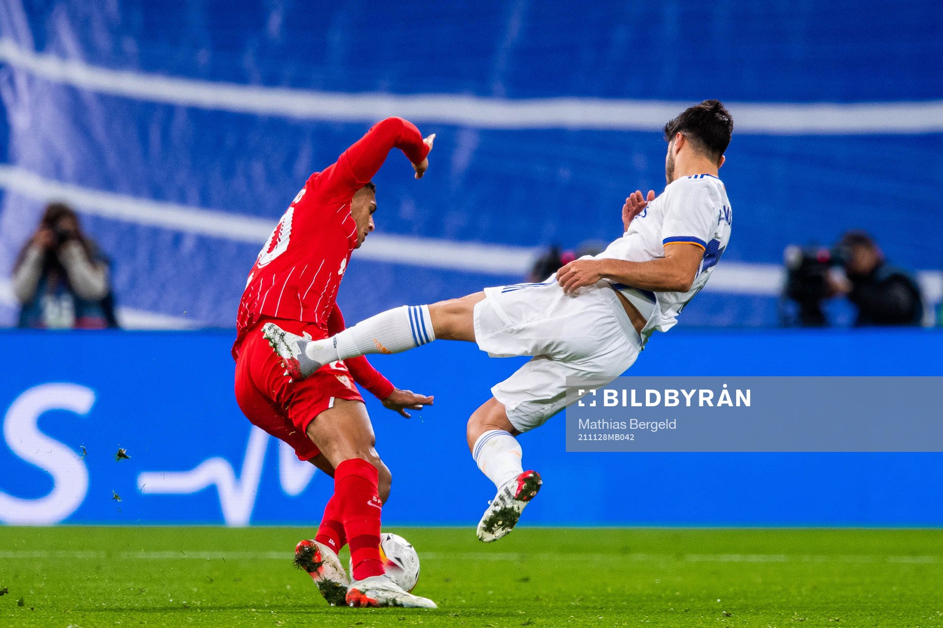 Diego Carlos of Sevilla and Marco Asensio of Real Madrid