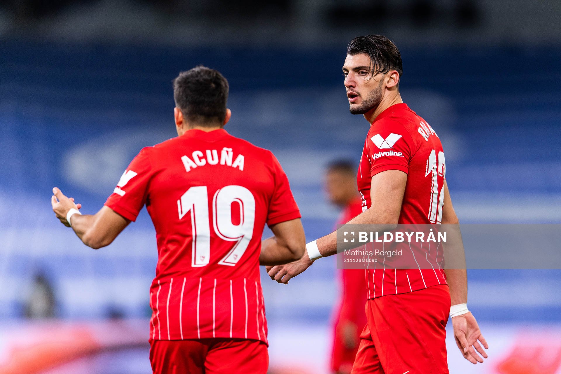 Marcos Acuna and Rafa Mir of Sevilla