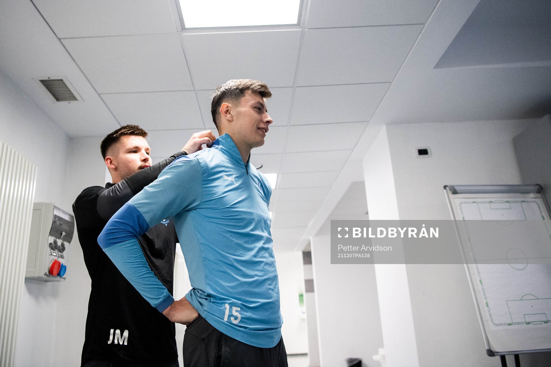 Physio Jamie Mackay and Anel Ahmedhodzic in the dressing