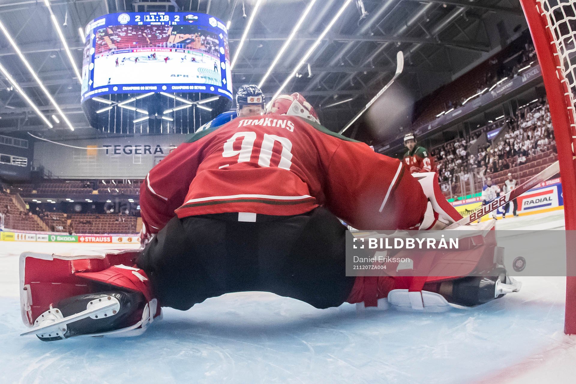 Carter Ashton  of Leksand and goalkeeper Matthew Tomkins of