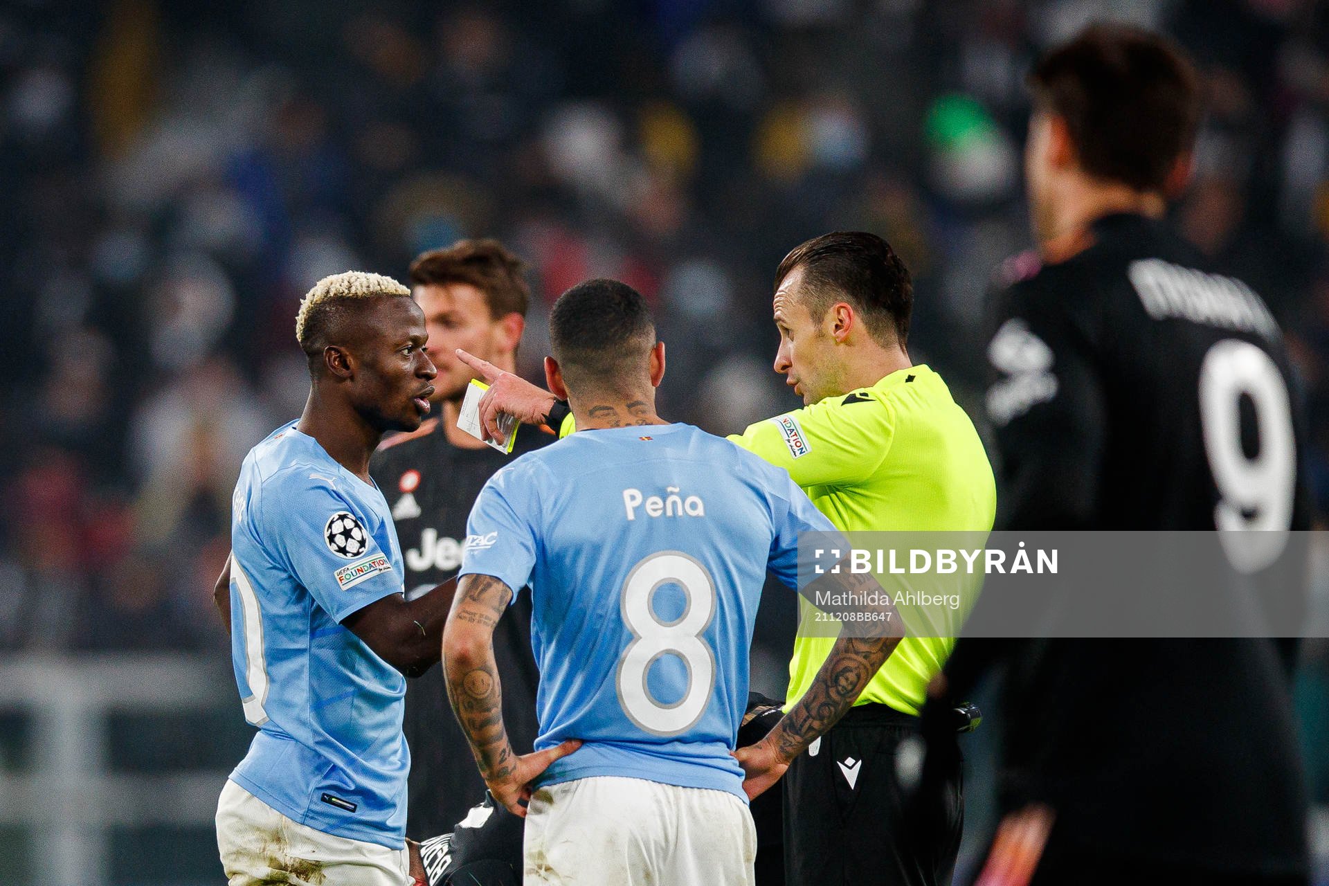 Bonke Innocent of Malmö FF and Referee Irfan Peljto