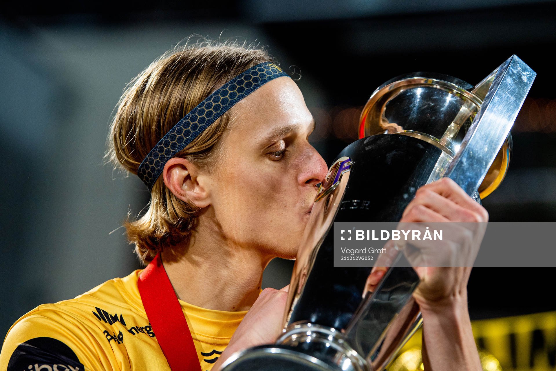 Ulrik Saltnes of Bodø/Glimt kisses the trophy winning the