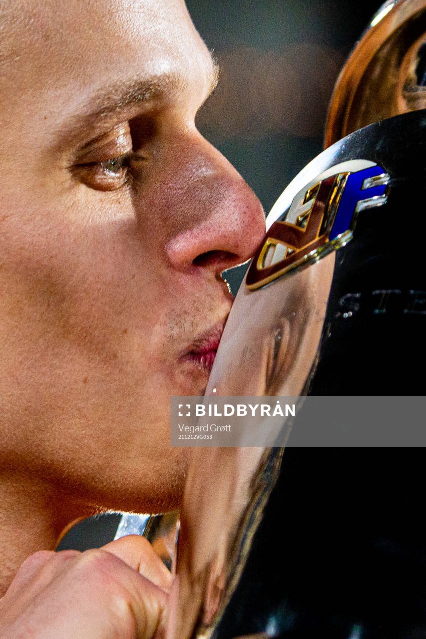 Ulrik Saltnes of Bodø/Glimt kisses the trophy winning the