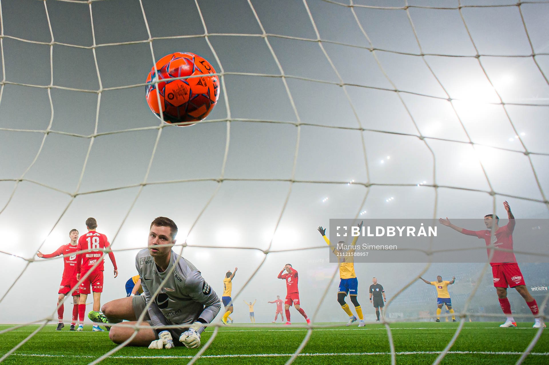 Torje Wichne of Jerv scores the 0-1 goal behind Hannes Lennart Grill of Brann during the Eliteserien playoff football match between Brann and Jerv on December 15, 2021 in Oslo.