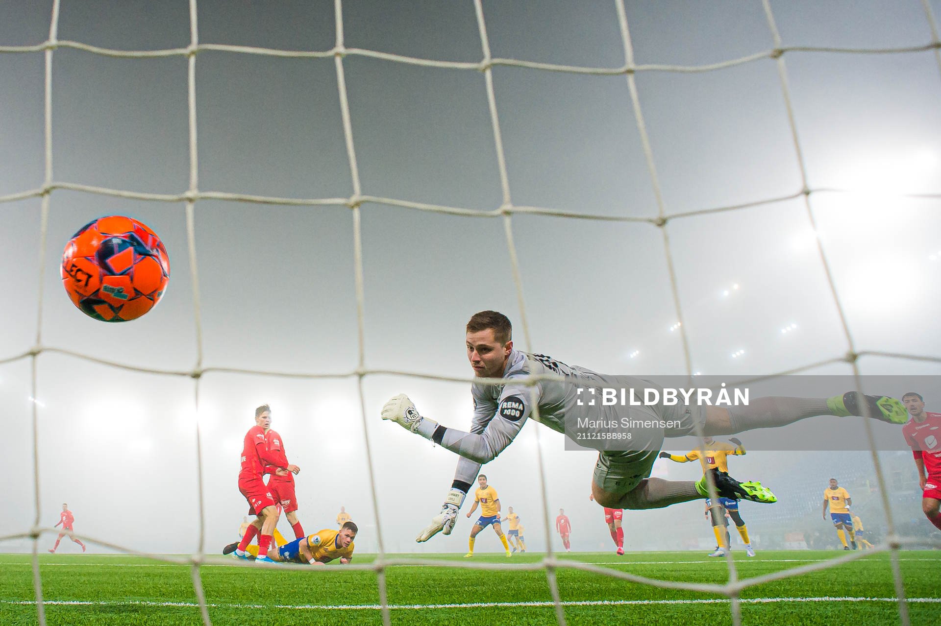 Torje Wichne of Jerv scores the 0-1 goal behind Hannes Lennart Grill of Brann during the Eliteserien playoff football match between Brann and Jerv on December 15, 2021 in Oslo.
