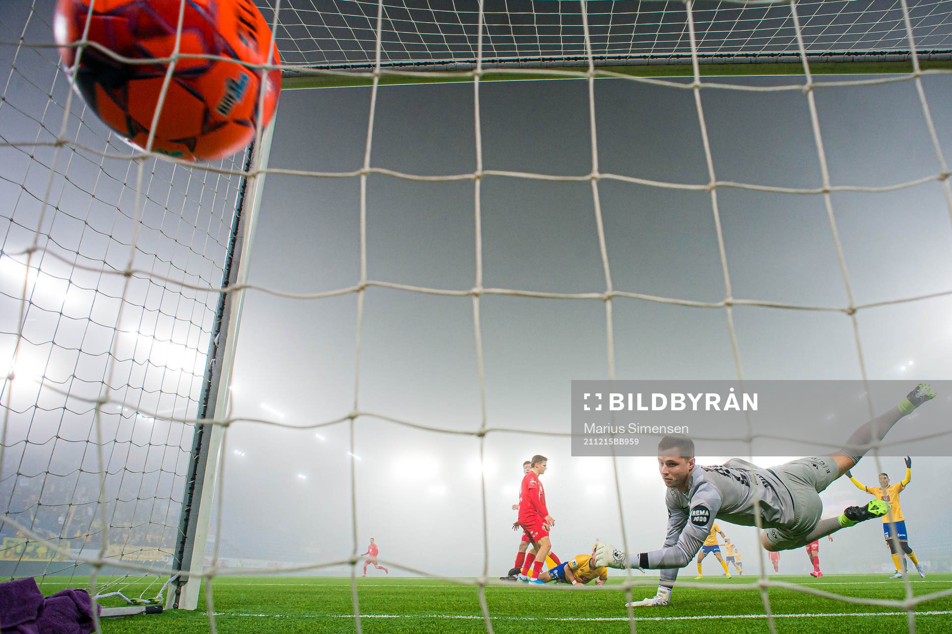 Torje Wichne of Jerv scores the 0-1 goal behind Hannes Lennart Grill of Brann during the Eliteserien playoff football match between Brann and Jerv on December 15, 2021 in Oslo.
