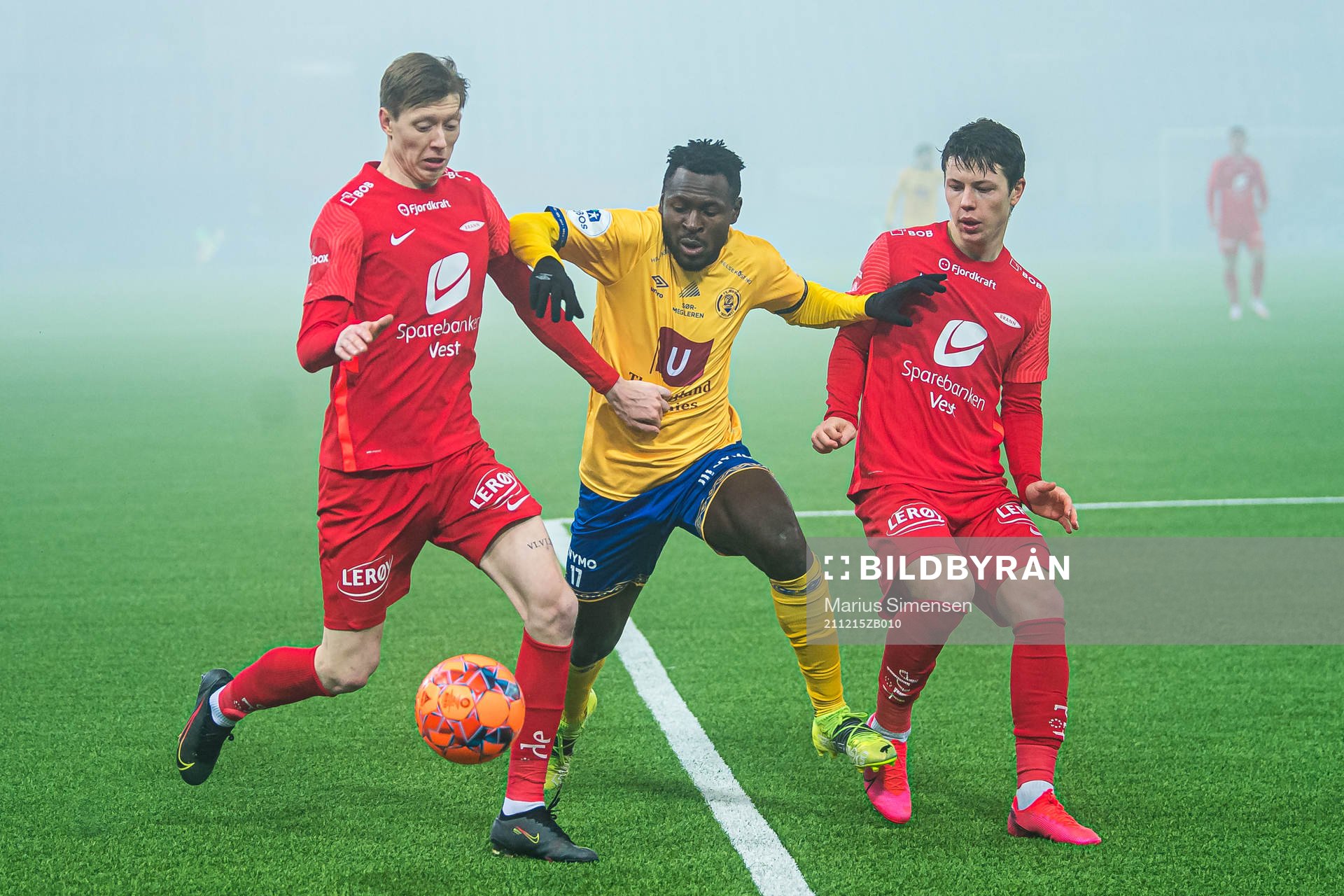 Ole Martin Lekven Kolskogen of Brann, Shuaibu Lalle Ibrahim of Jerv and Mathias Knutsen Rasmussen of Brann during the Eliteserien playoff football match between Brann and Jerv on December 15, 2021 in Oslo.