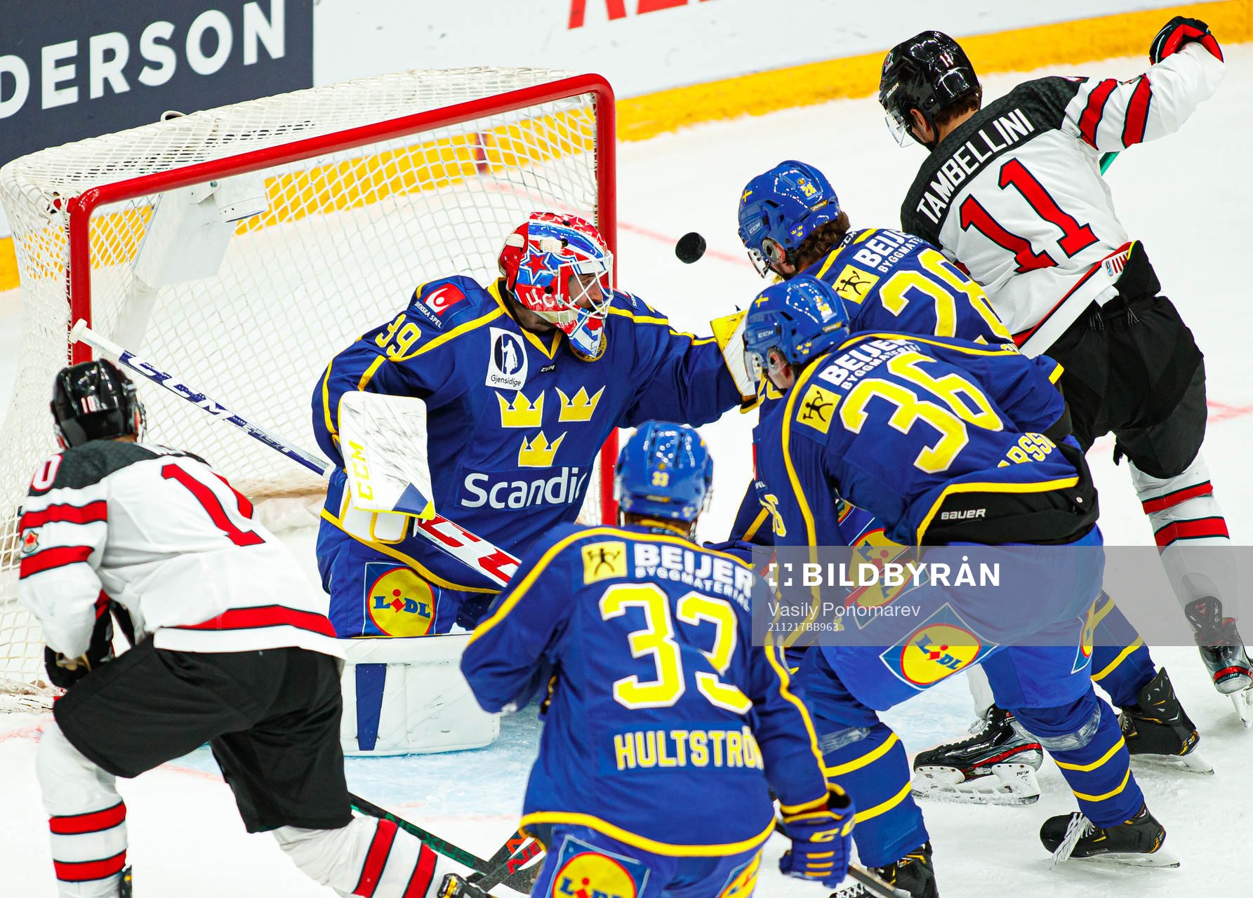 Adam Reideborn of Sweden vies of Canada