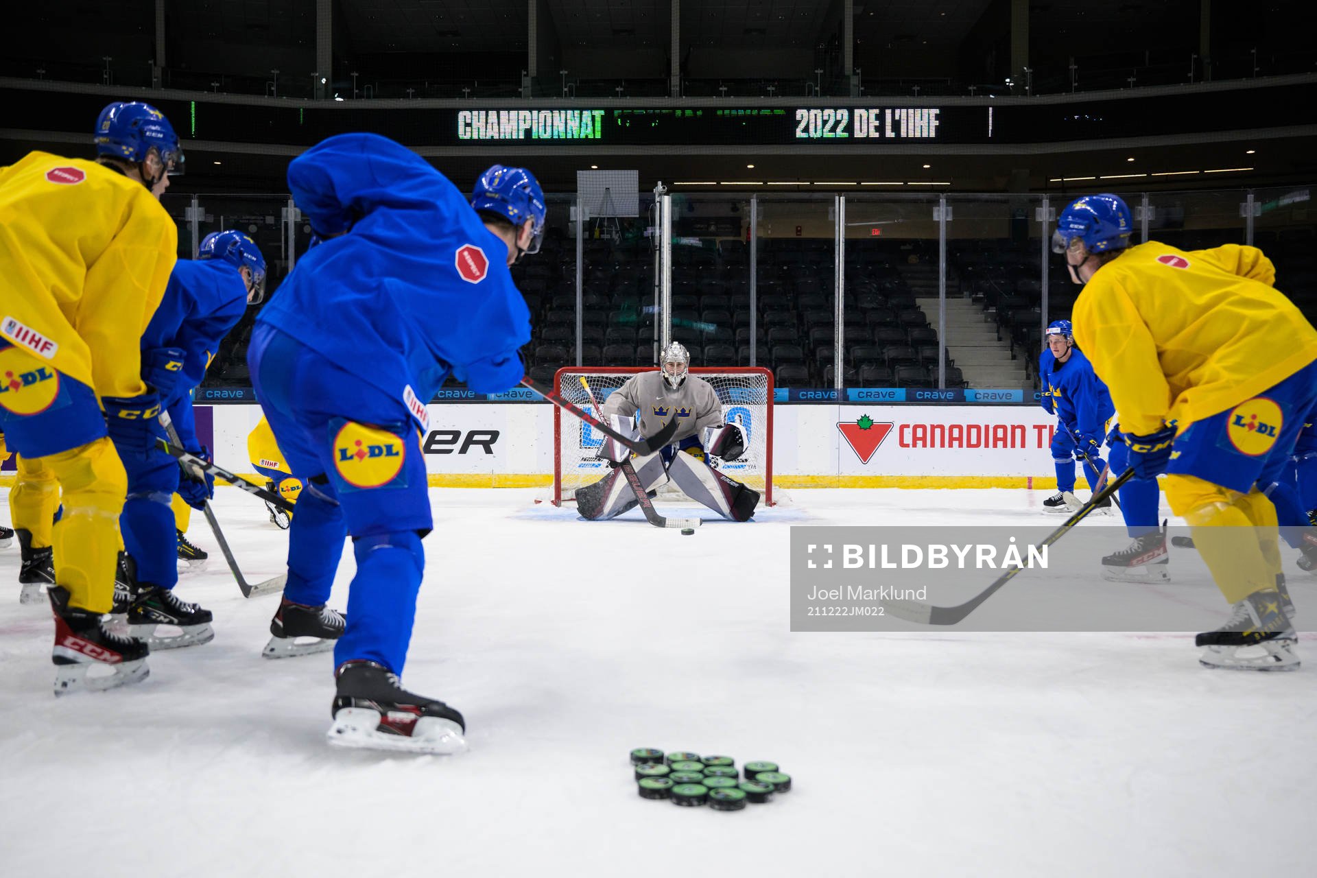 Helge Grans shoots against goaltender Jesper Vikman of the