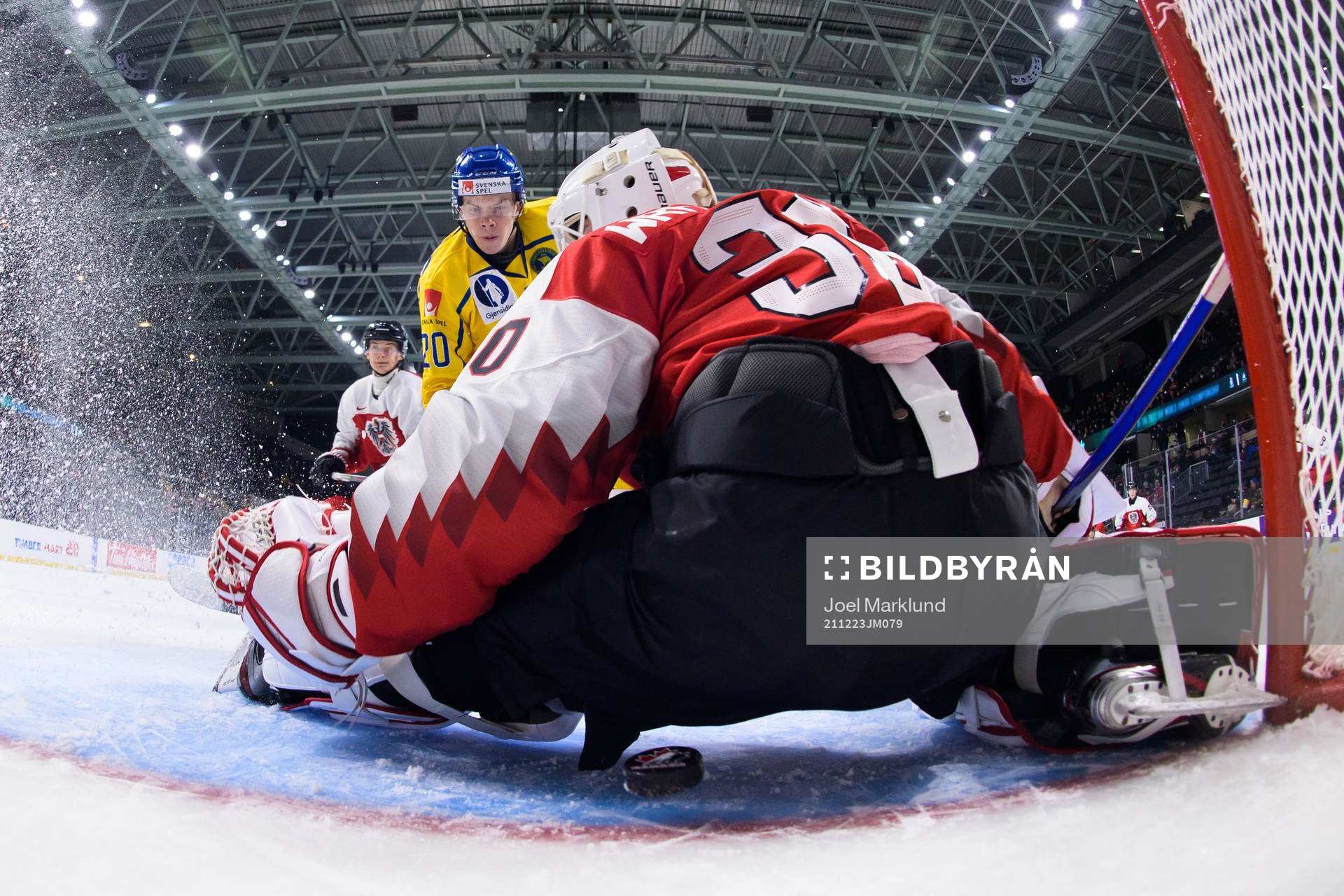 Albert Sjöberg of Sweden scores 2-0 behind goaltender