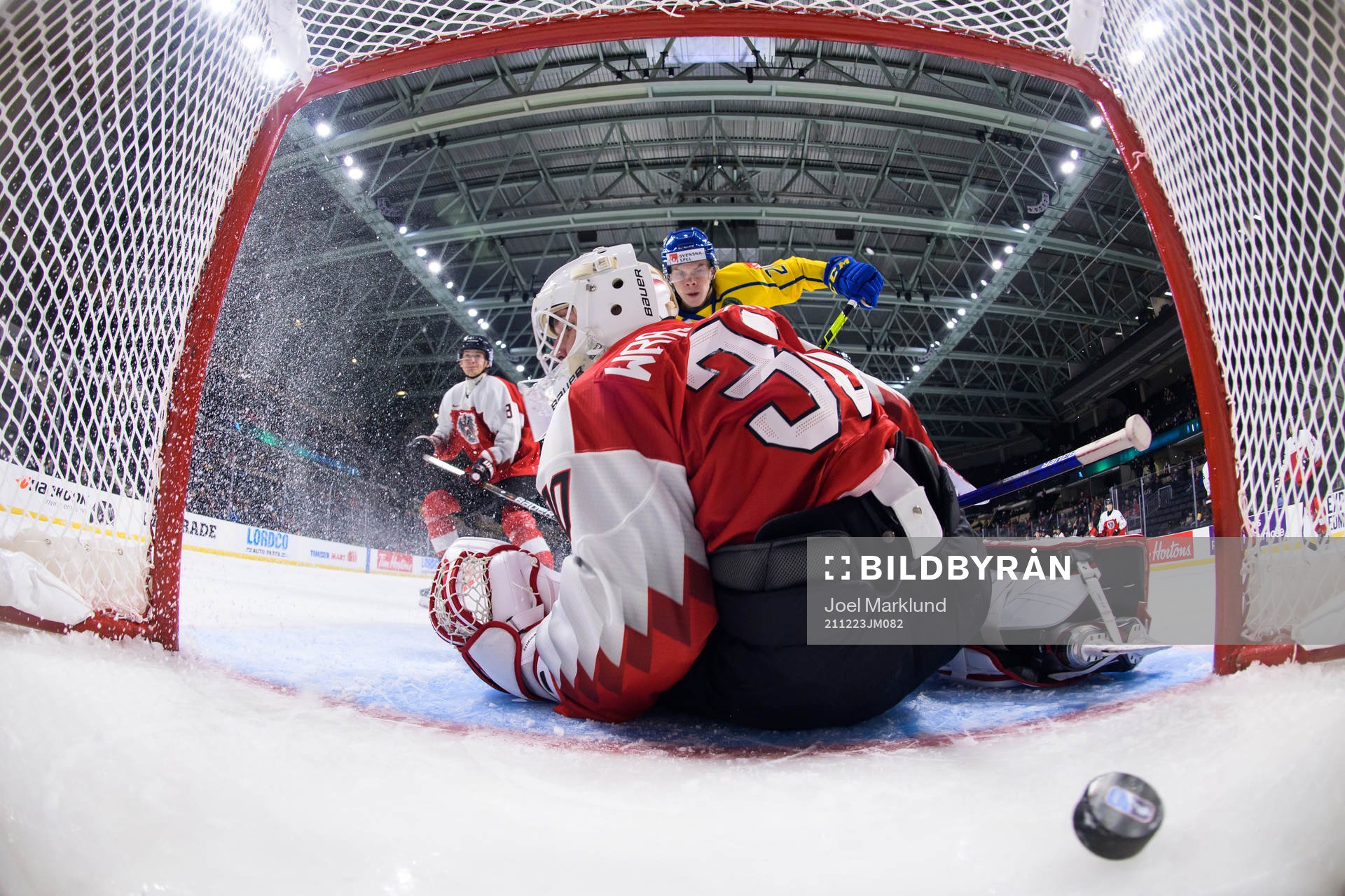 Albert Sjöberg of Sweden scores 2-0 behind goaltender