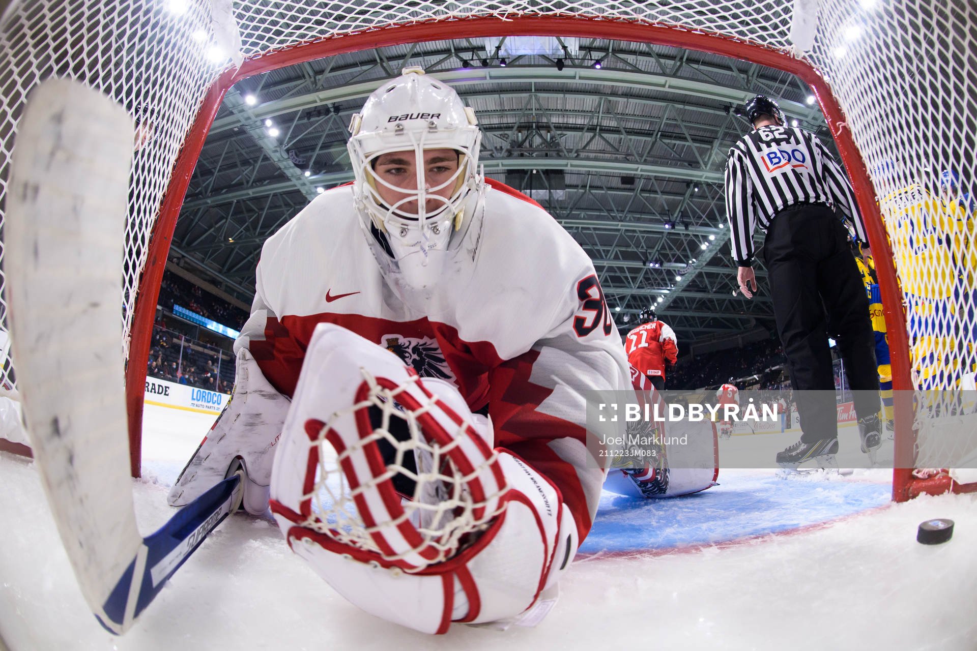 Goaltender Sebastian Wraneschitz of Austria looks dejected