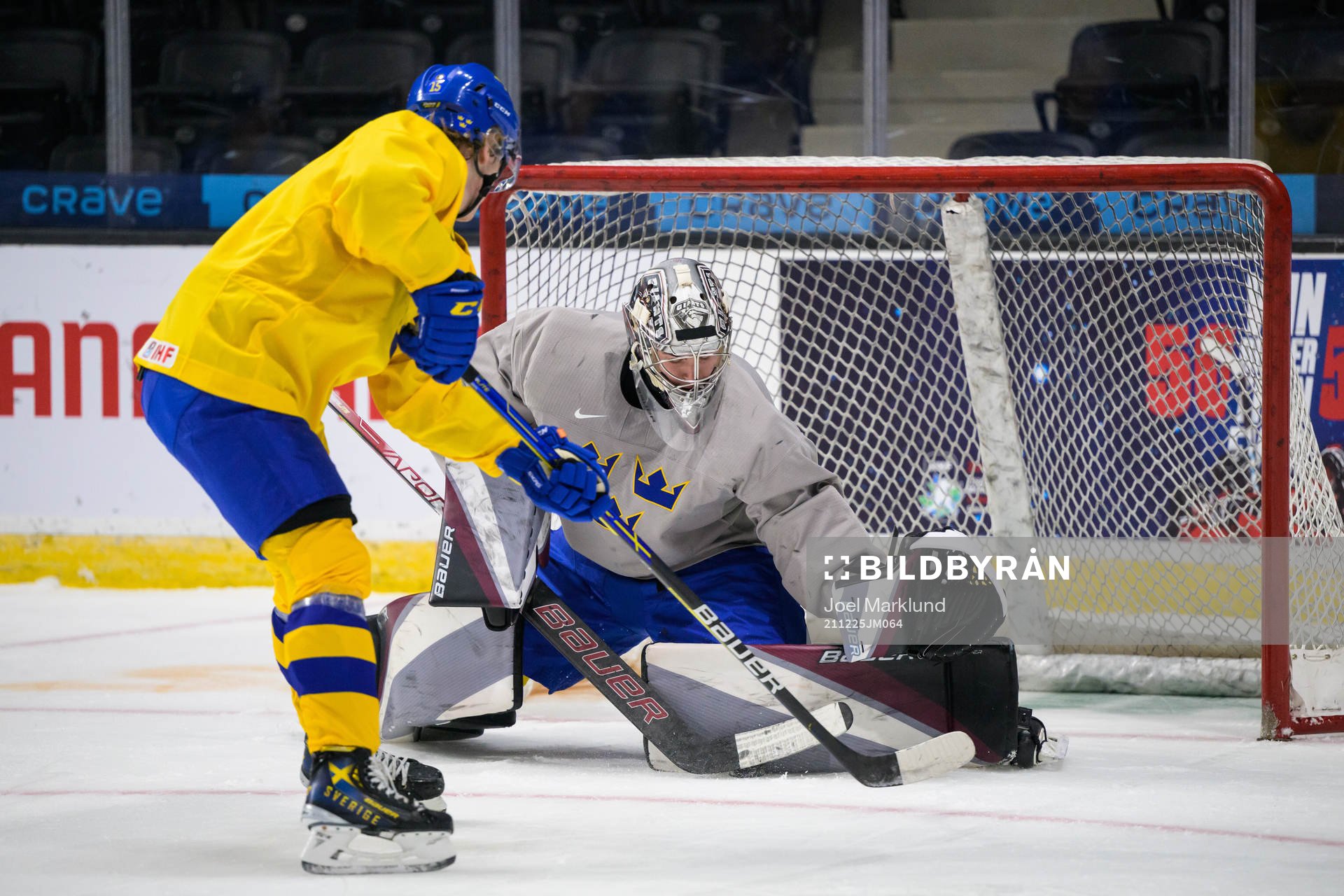 Åke Stakkestad shoots at goaltender Jesper Vikman of
