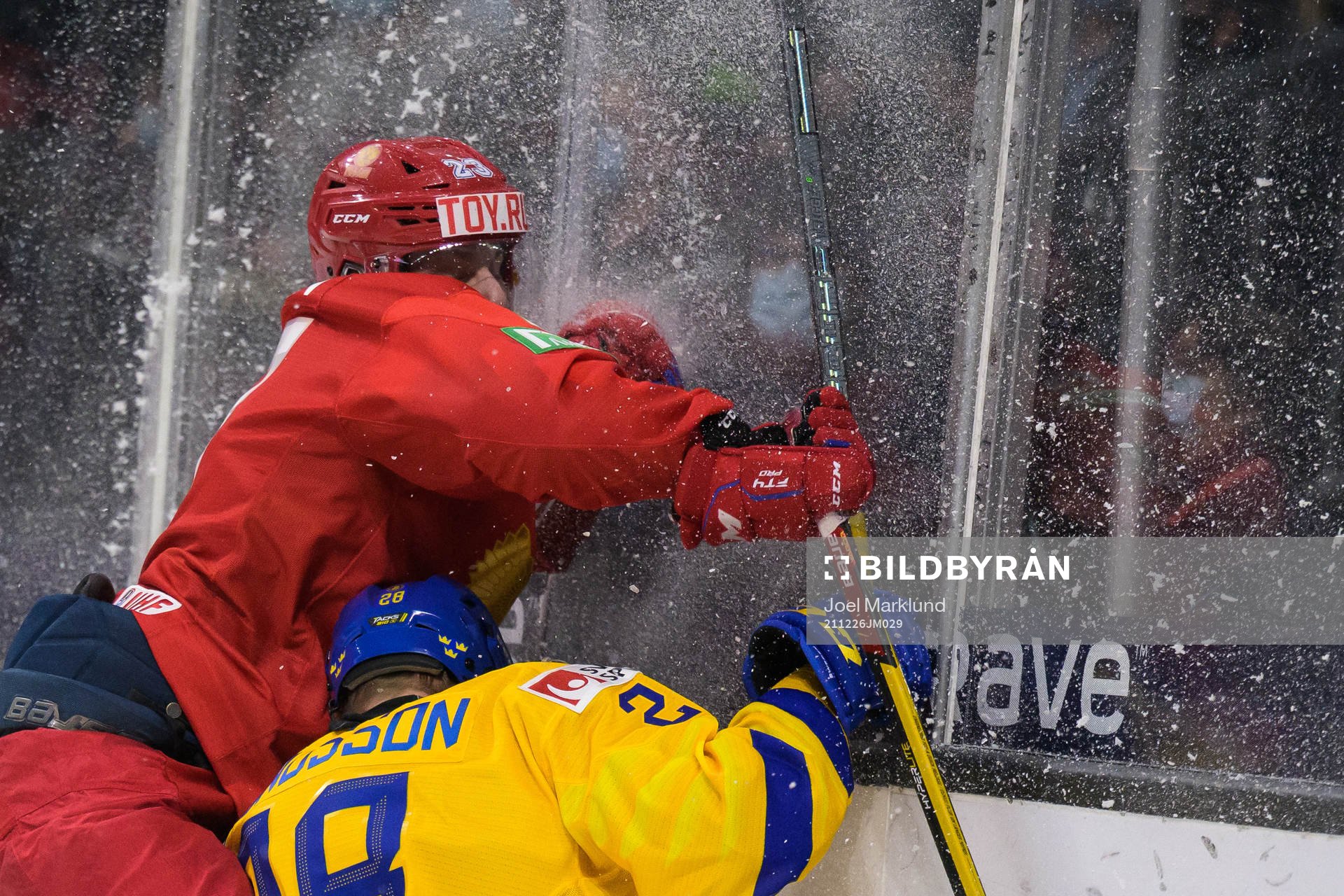 Dmitri Zlodeyev of Russia tackles Oskar Magnusson of Sweden