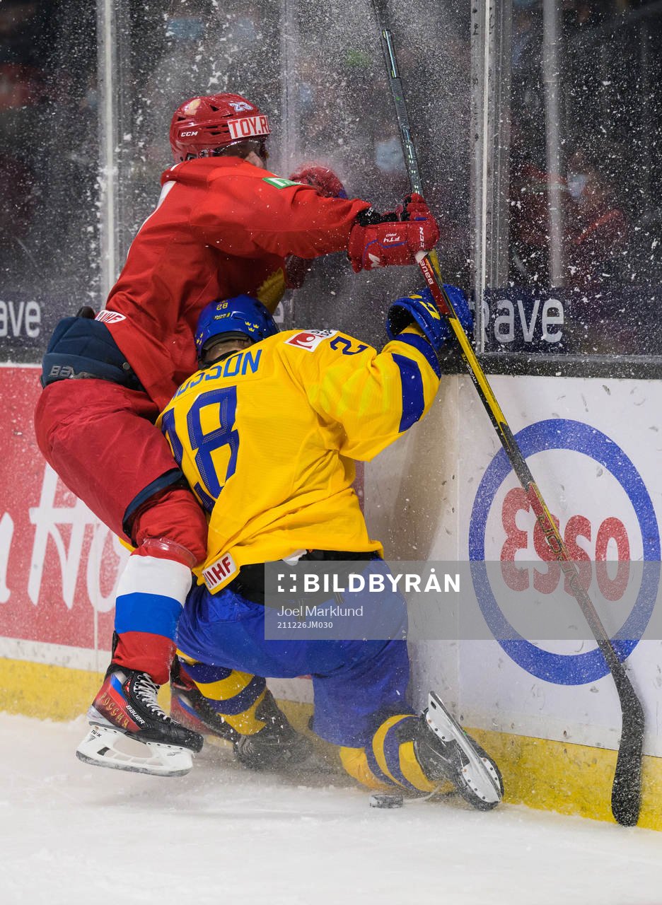 Dmitri Zlodeyev of Russia tackles Oskar Magnusson of Sweden