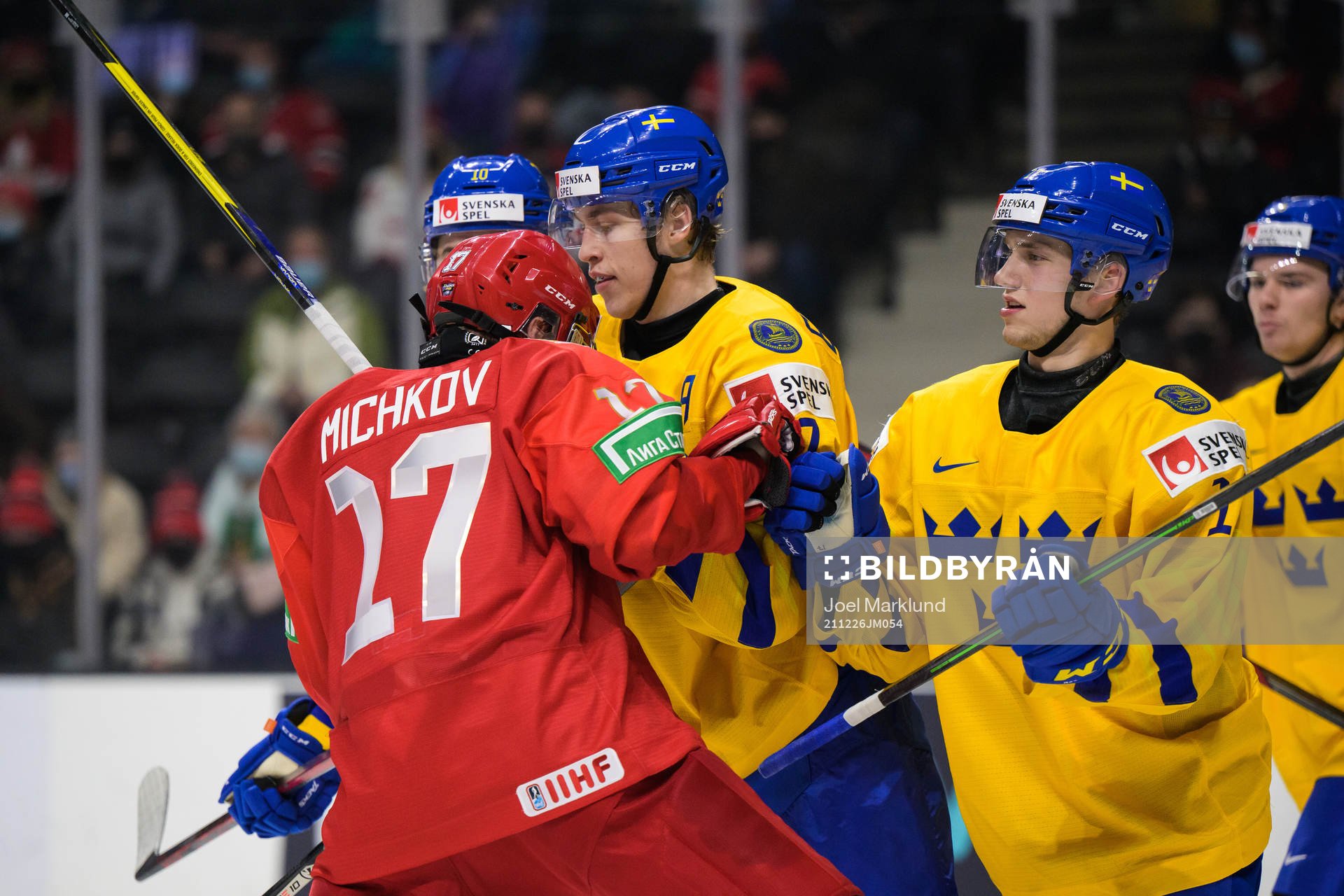 Matvey Michkov of Russia in a fight against Simon Edvinsson