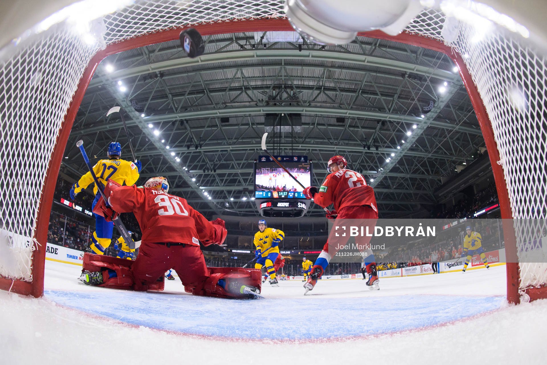 William Eklund of Sweden blocks goaltender Yaroslav Askarov