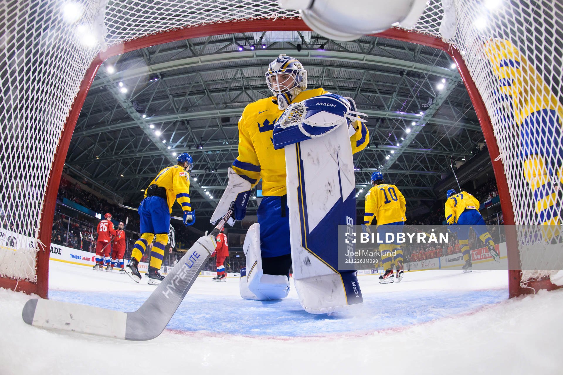 Goaltender Jesper Wallstedt of Sweden looks dejected