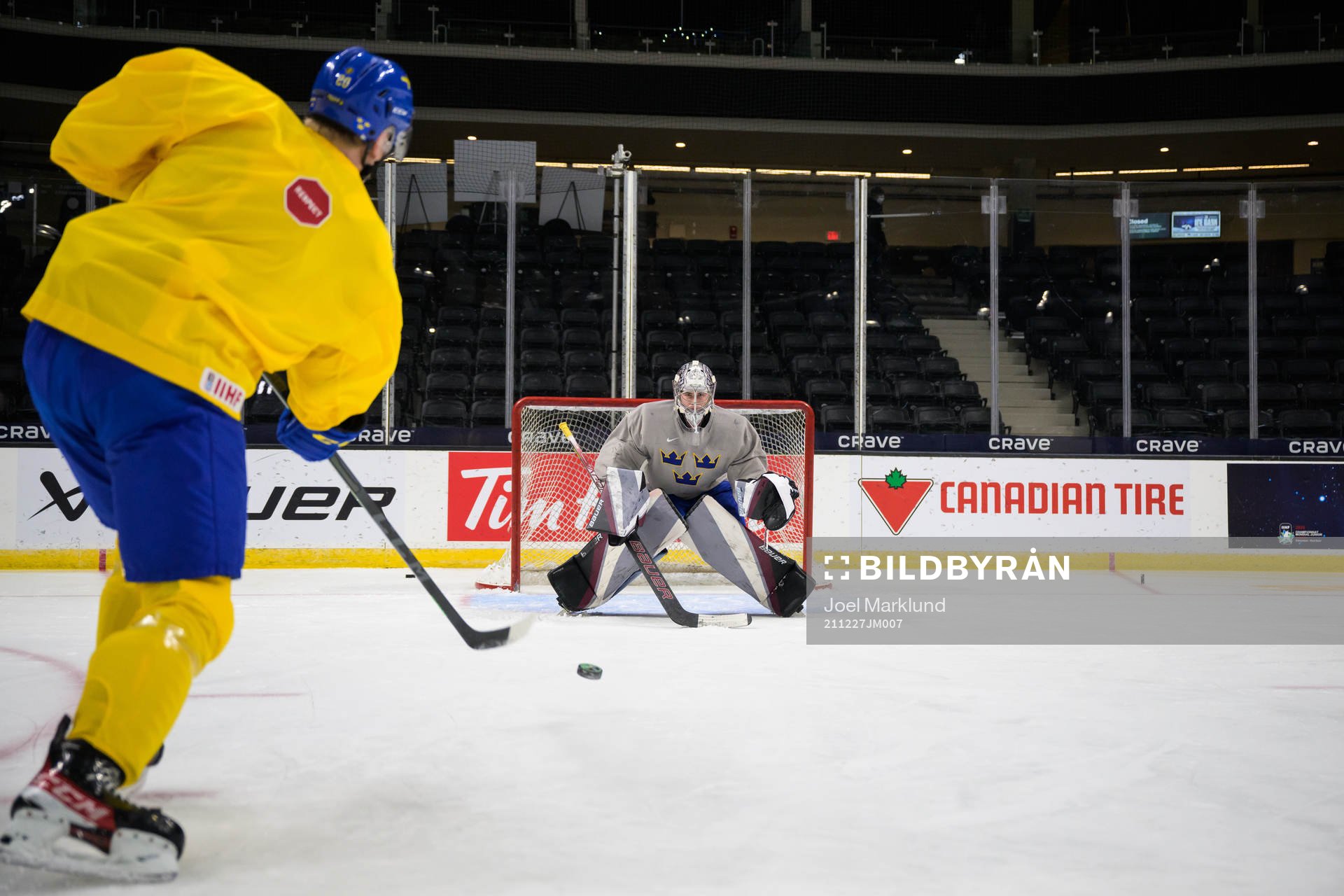 Albert Sjöberg and goaltender Jesper Vikman of Sweden at a