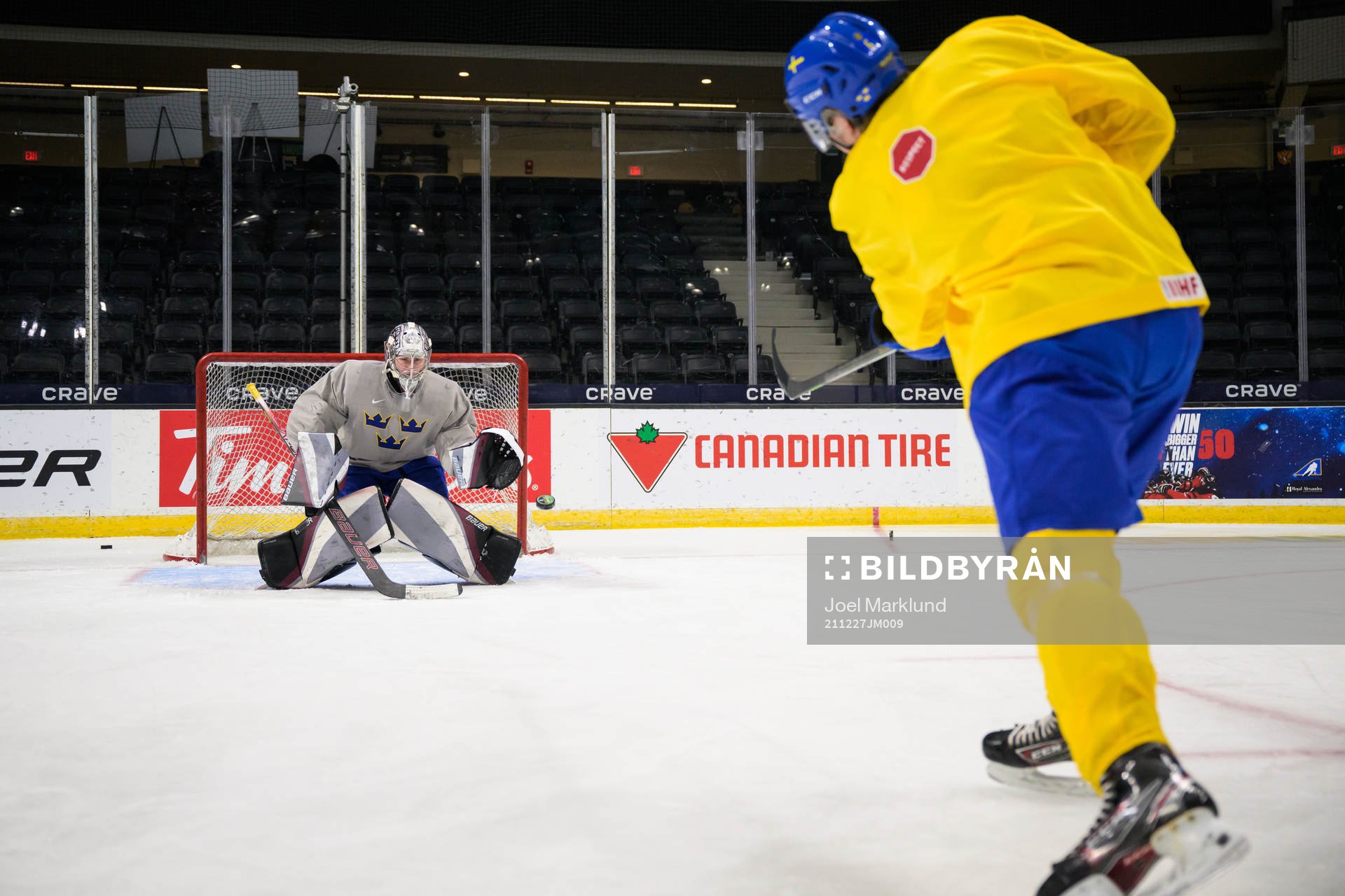 Goaltender Jesper Vikman and Måns Forsfjäll of Sweden at