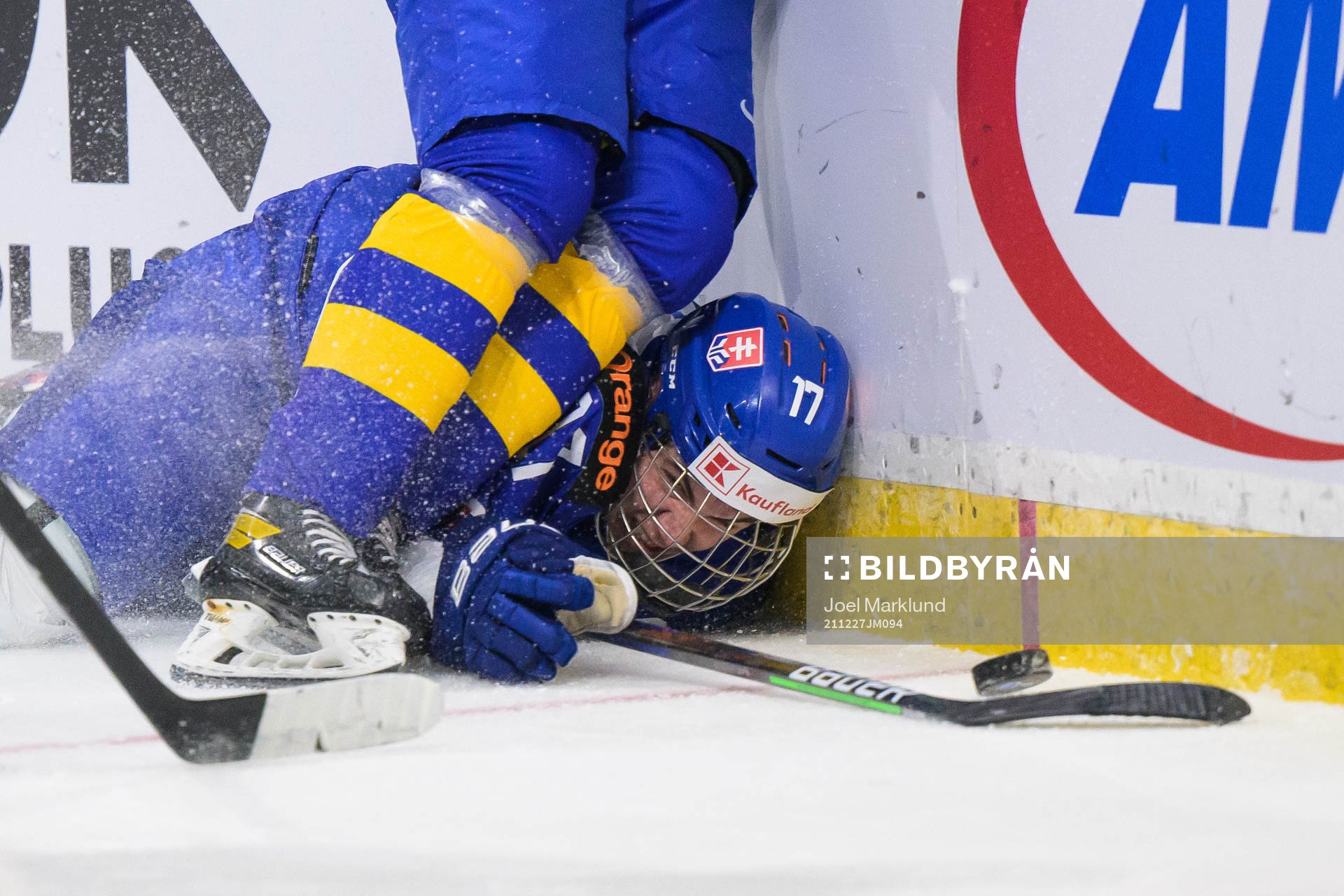 Simon Nemec of Slovakia falls against Victor Sjöholm of