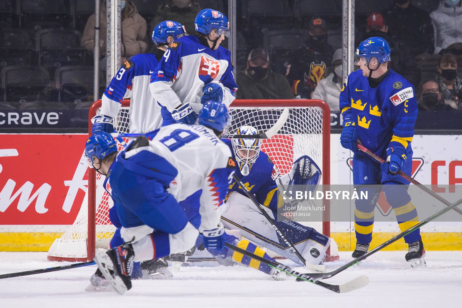 Goaltender Jesper Wallstedt of Sweden makes a save from